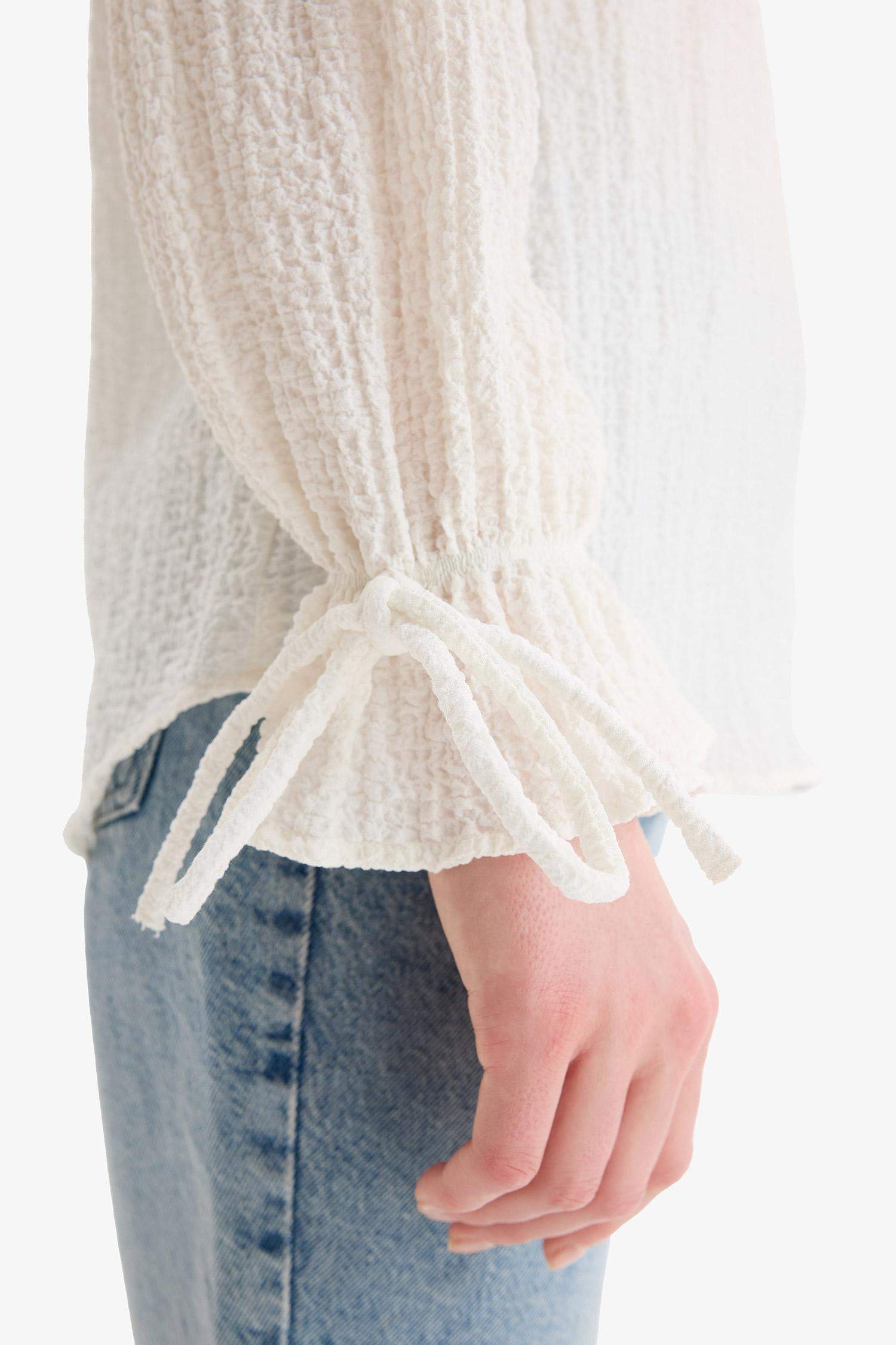 Blouse tunique texturée à manches longues