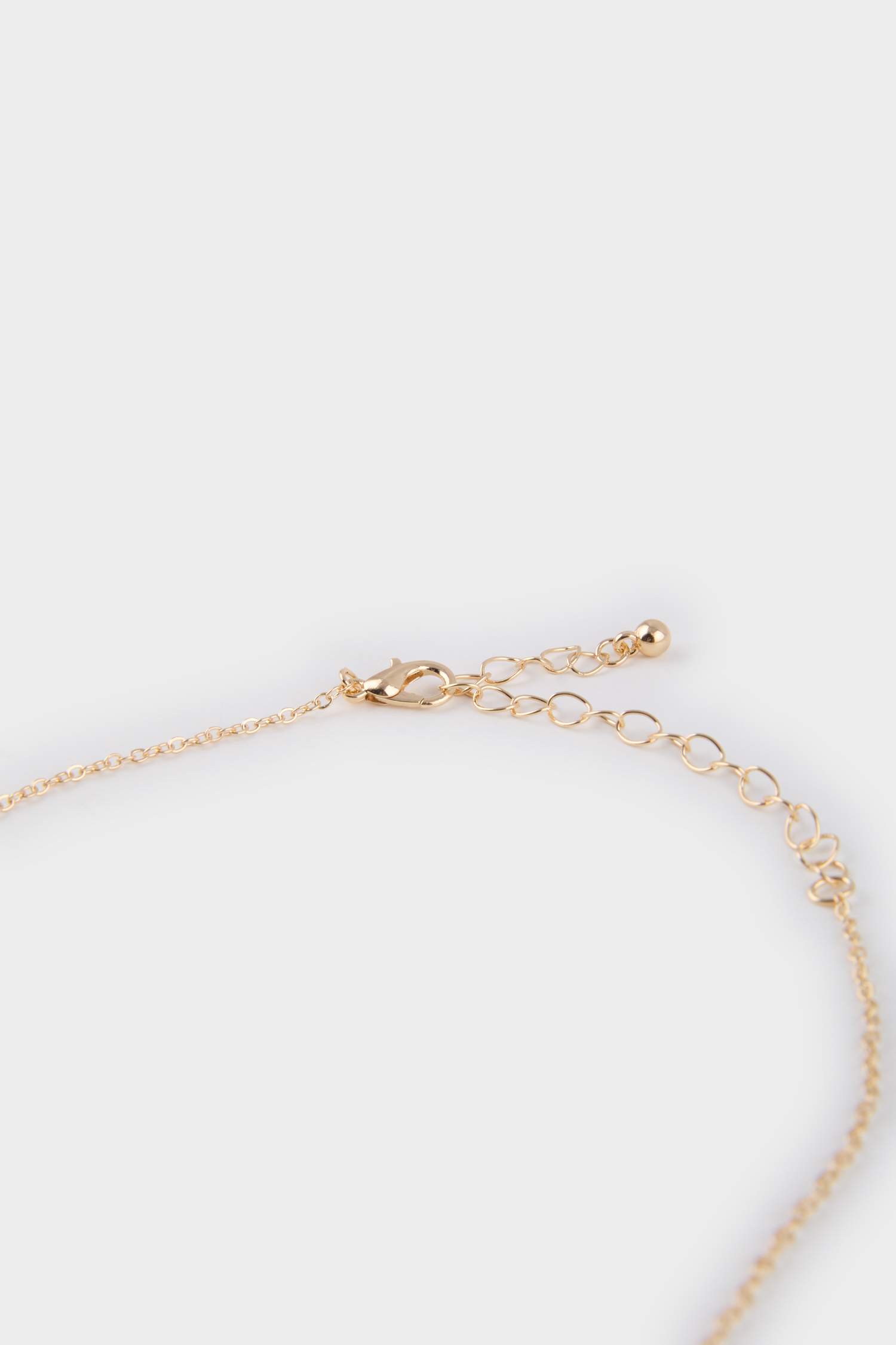 Collier doré avec fleur verte pour femme