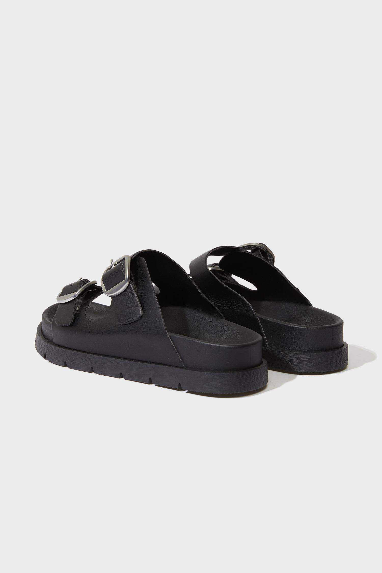 صندل نسائي من جلد صناعي بكعب مسطح بشريط مزدوج