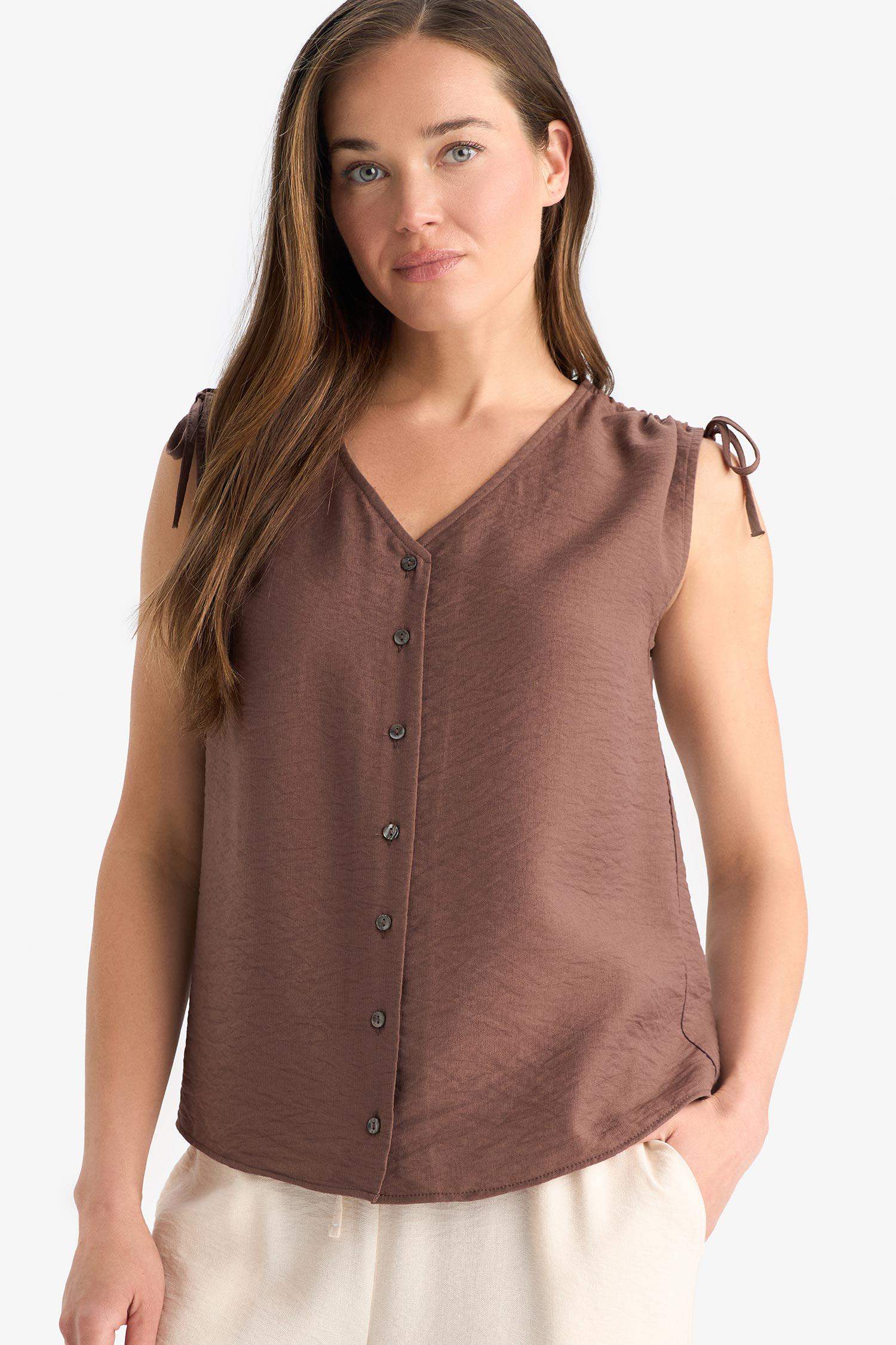 Blouse froncée sans manches à col en V