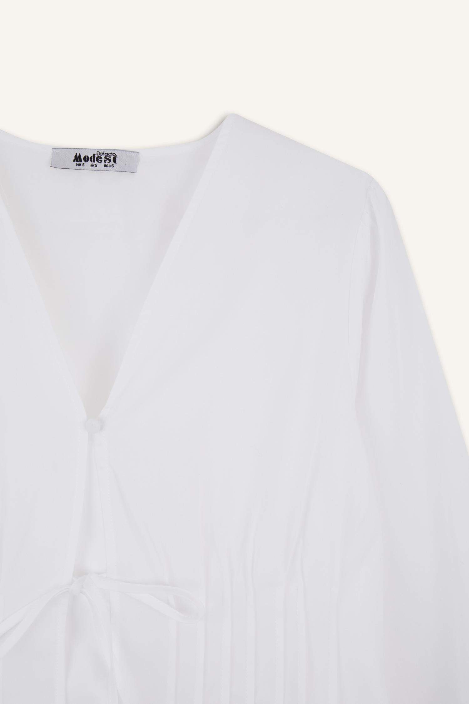 بلوزة طويلة بوبلين ردن طويل بقصة عادية وياخة V