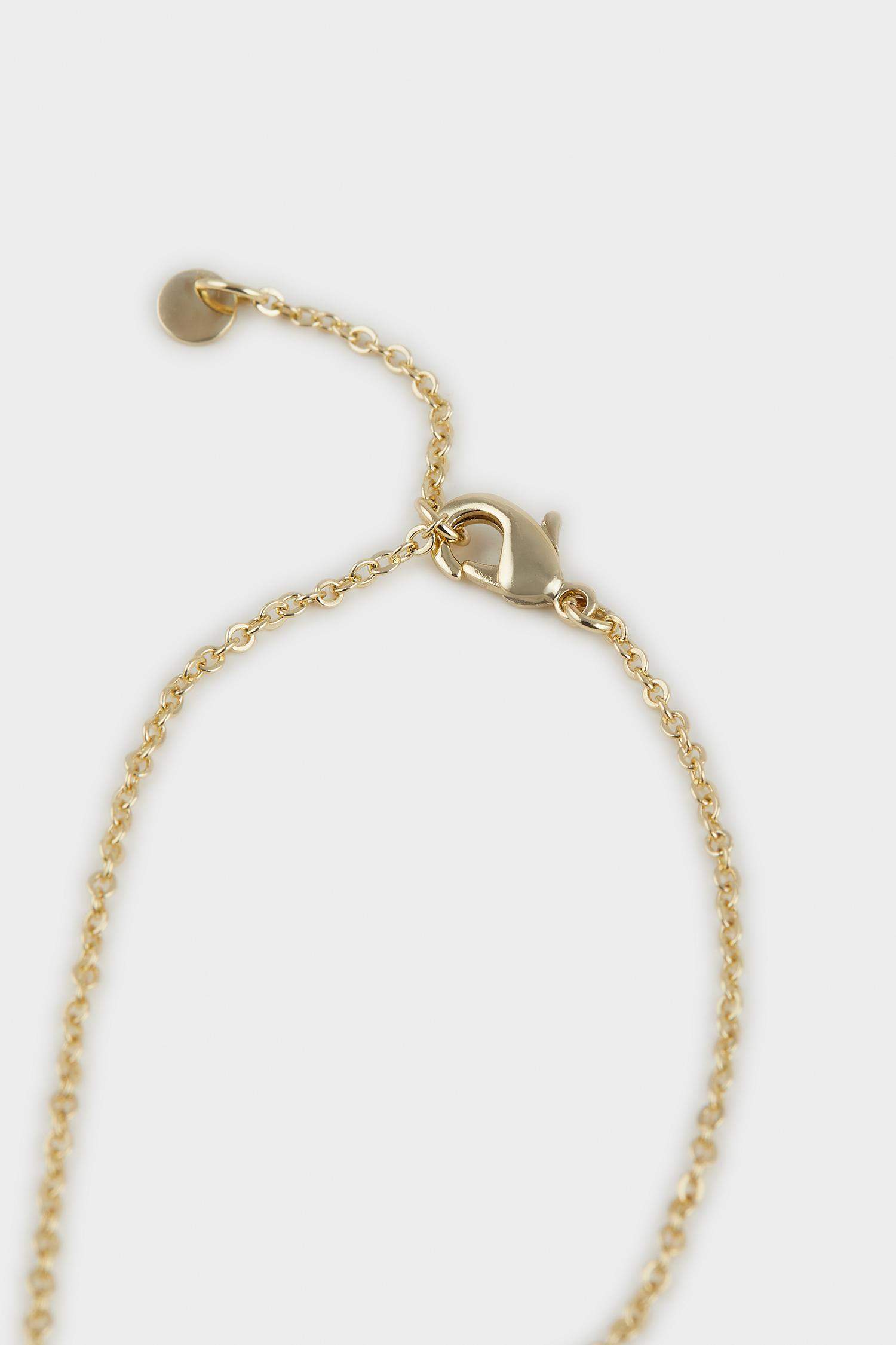 سوار يد ذهبي بحجر بنفسجي من Reis x DeFacto