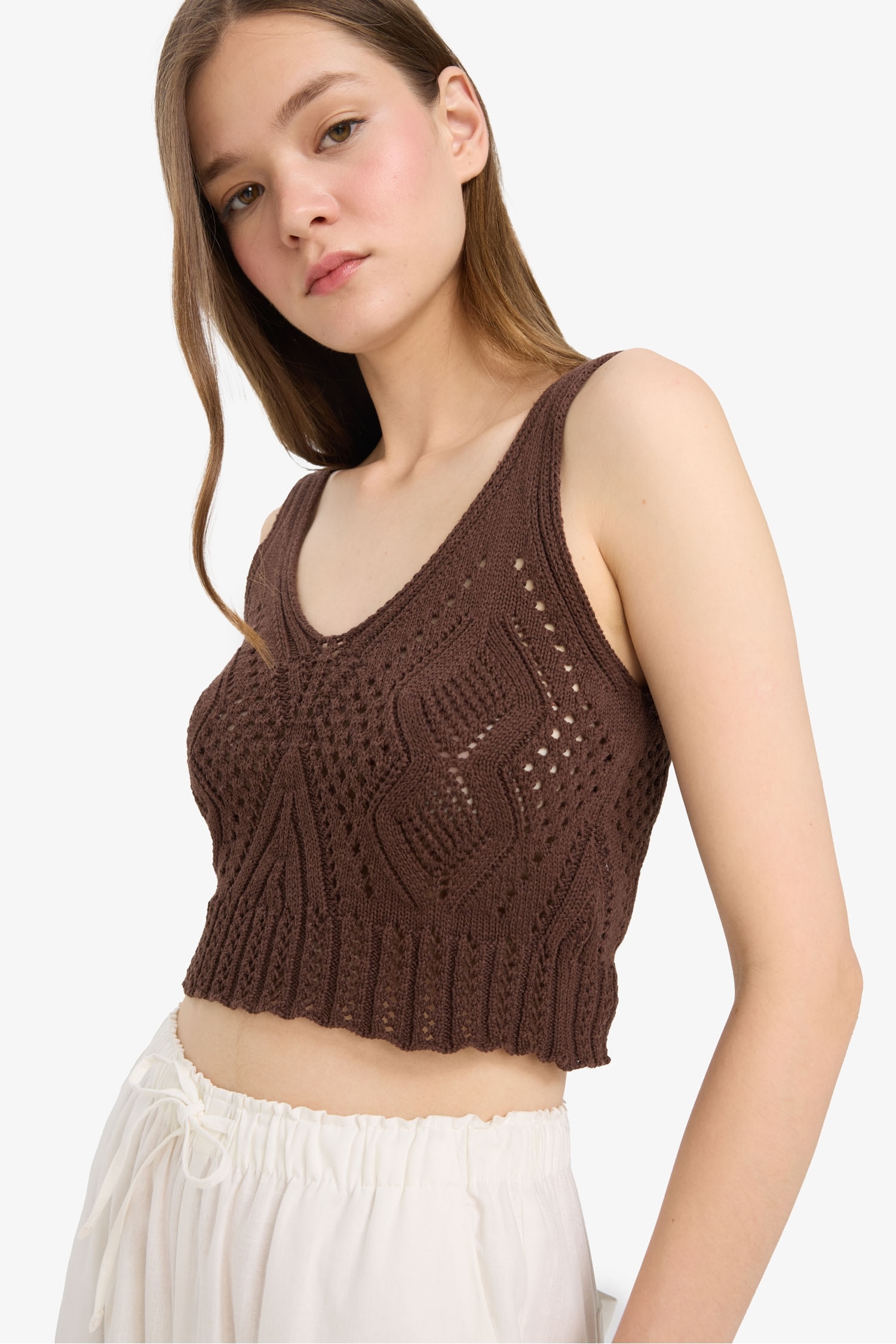 Top à bretelles slim en crochet Col V