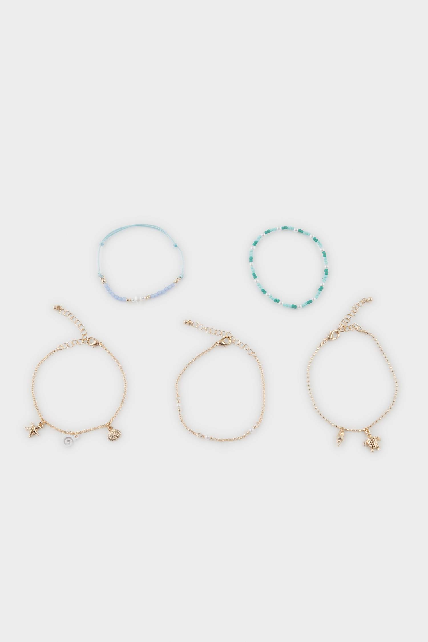 طقم 5 أساور ذهبية بحبات زرقاء نسائي