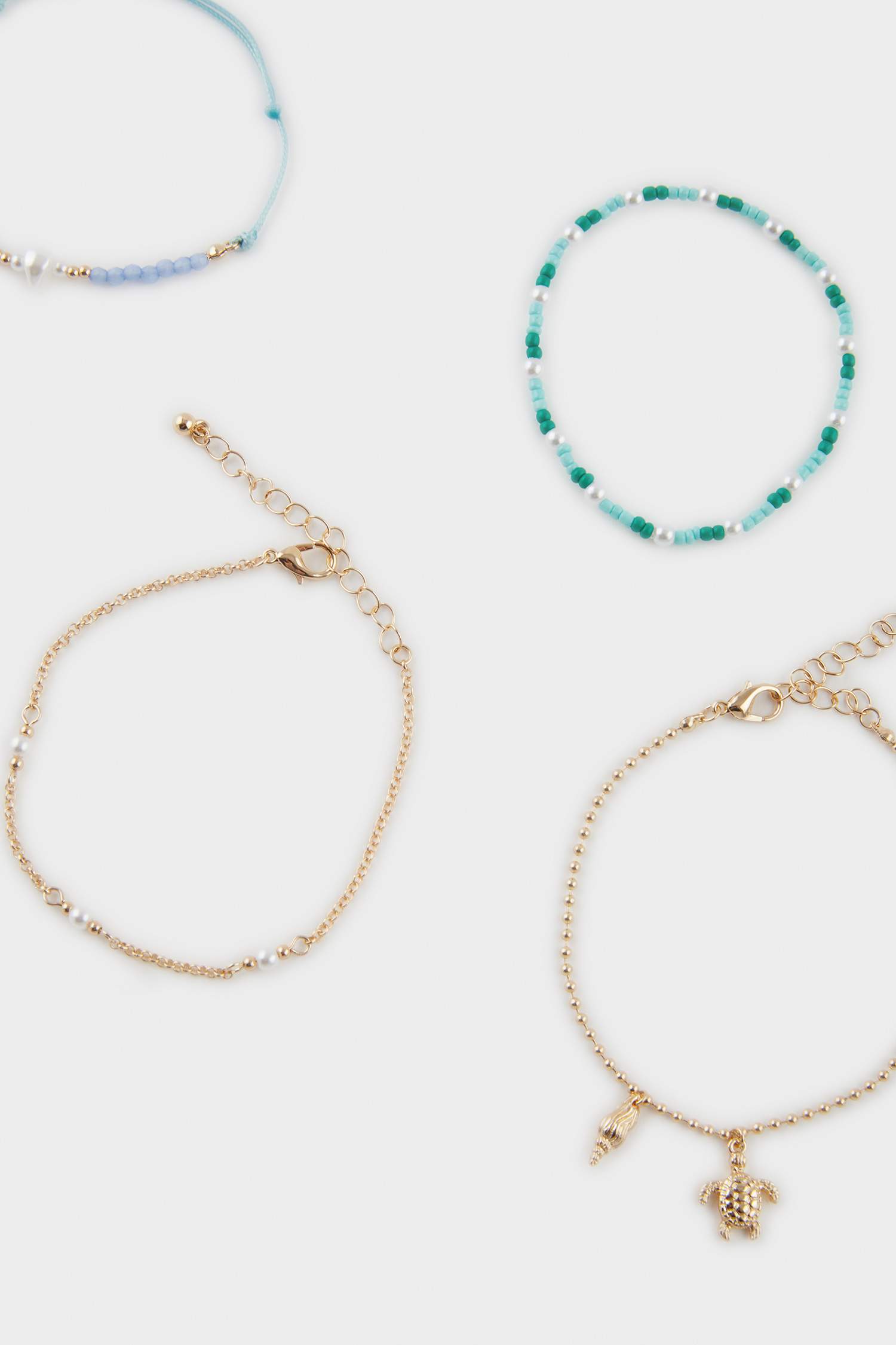 Woman 5 Piece Blue Beaded Gold Bracelet