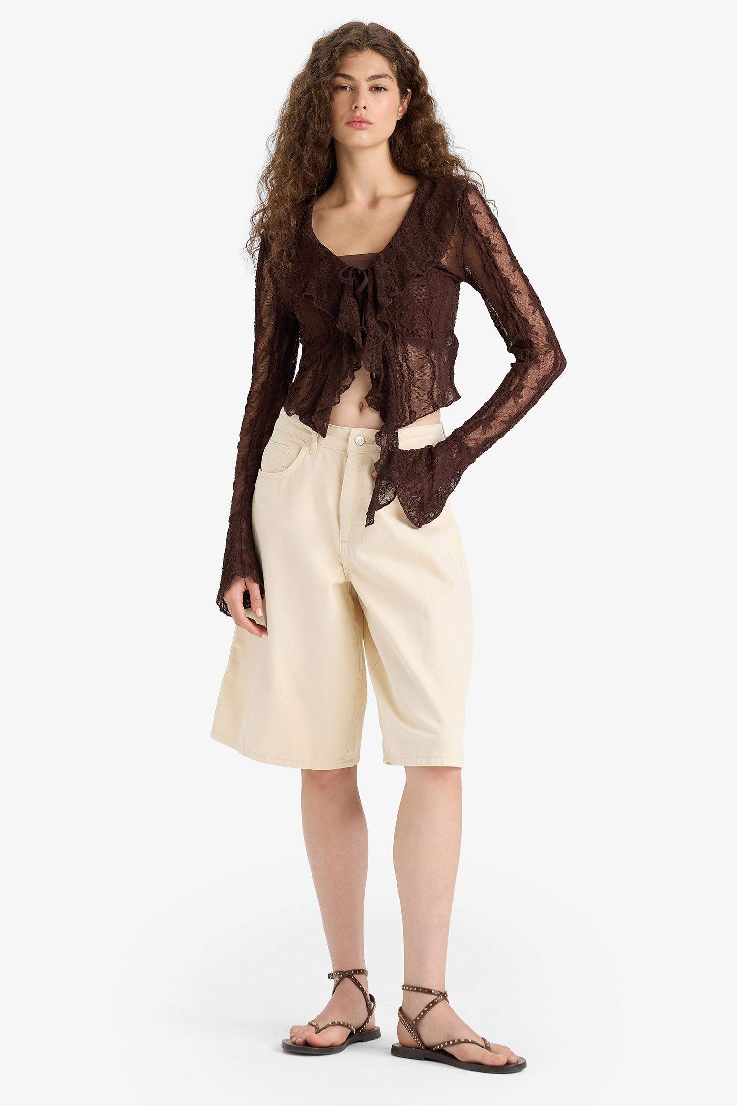 Blouse slim en dentelle à col V et manches longues