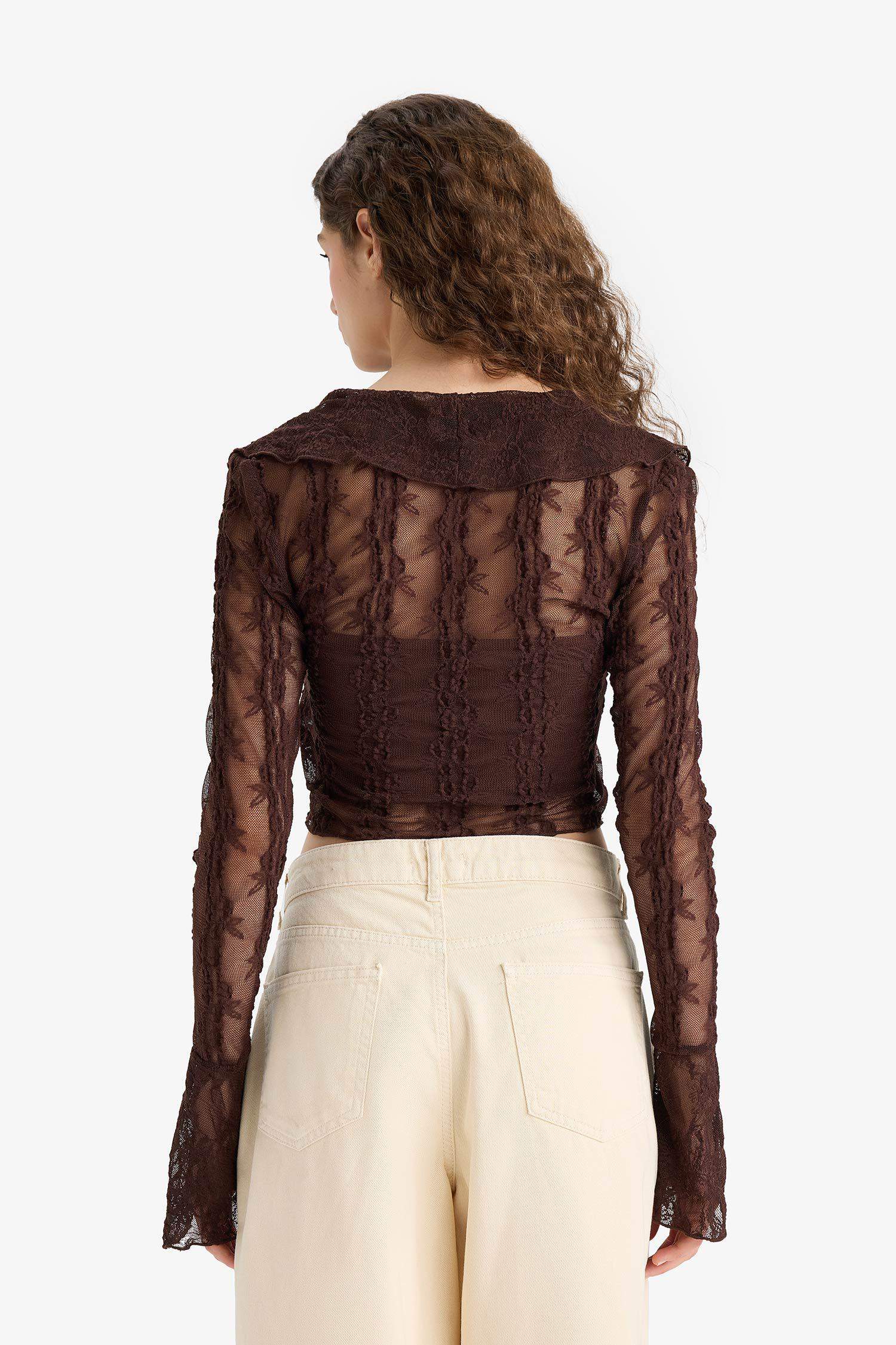 Blouse slim en dentelle à col V et manches longues
