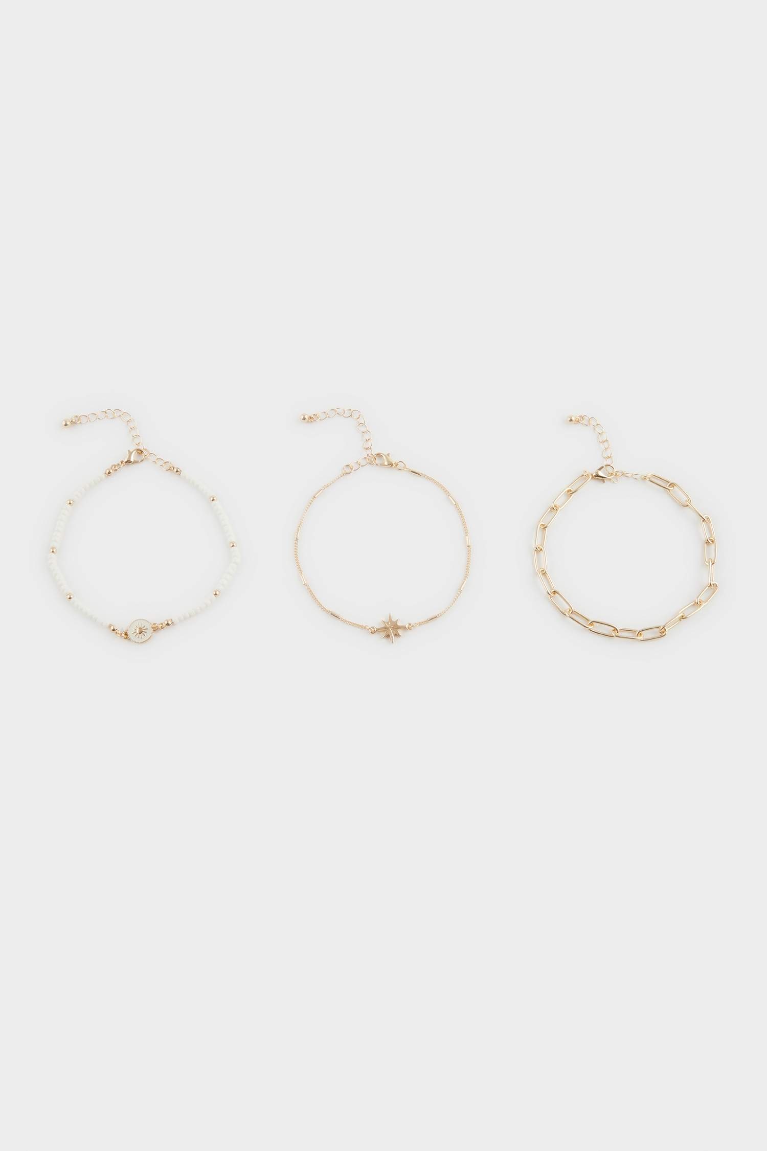 Woman 3 Piece Golden Anklets