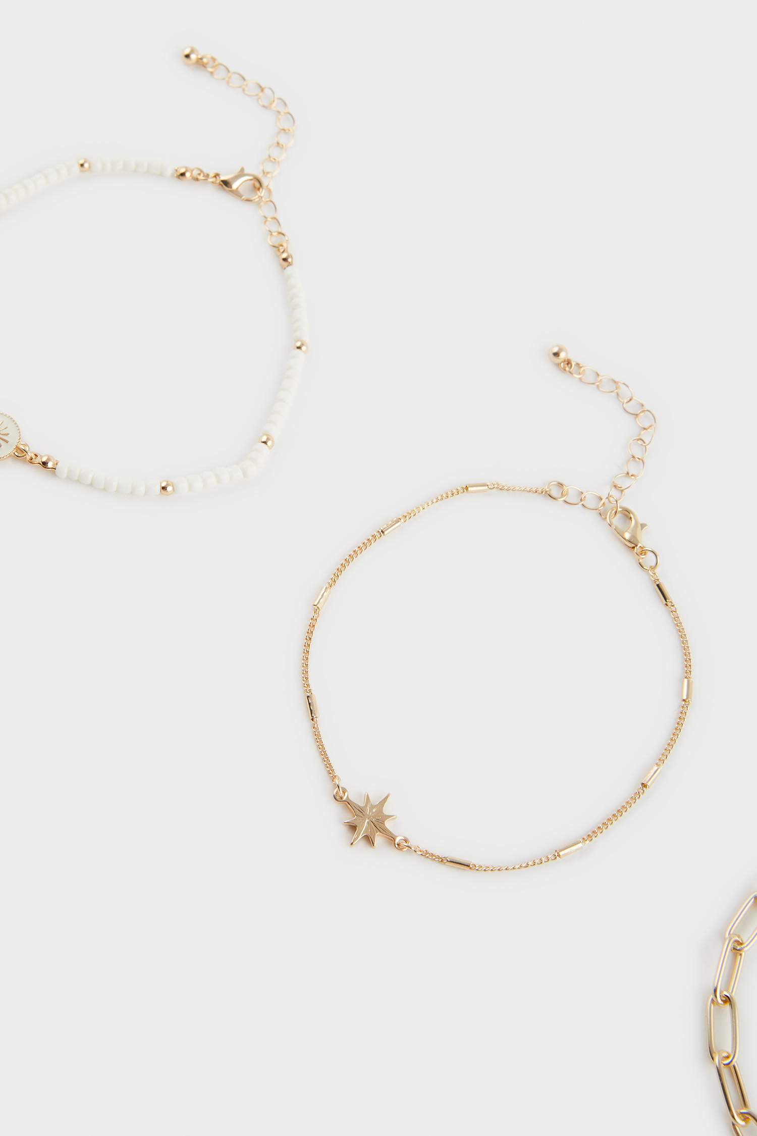 Woman 3 Piece Golden Anklets