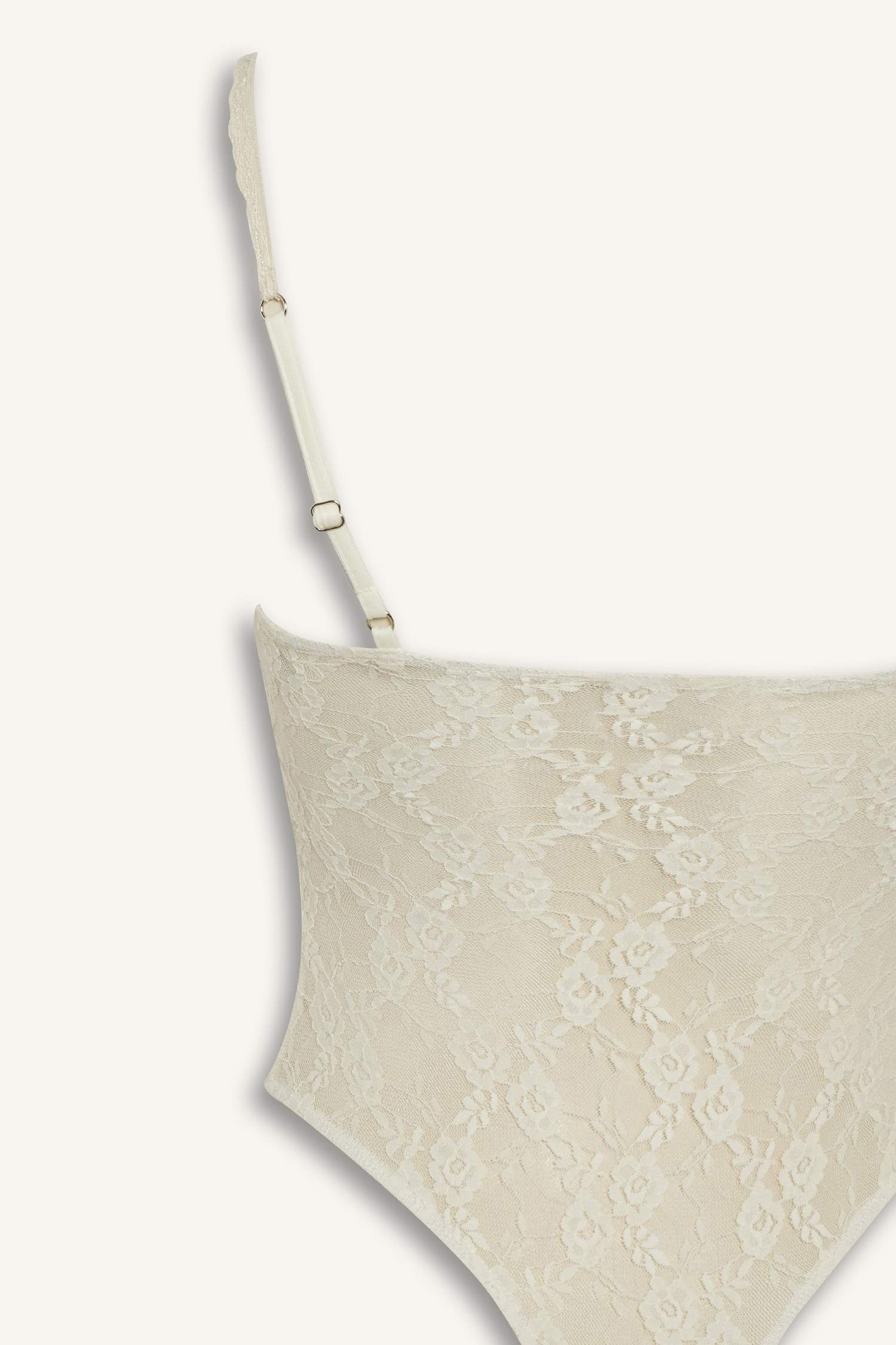 Body à fines bretelles en dentelle avec boutons-pression