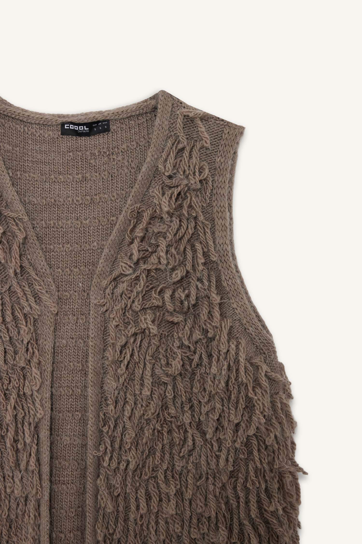 Gilet à détails frangés