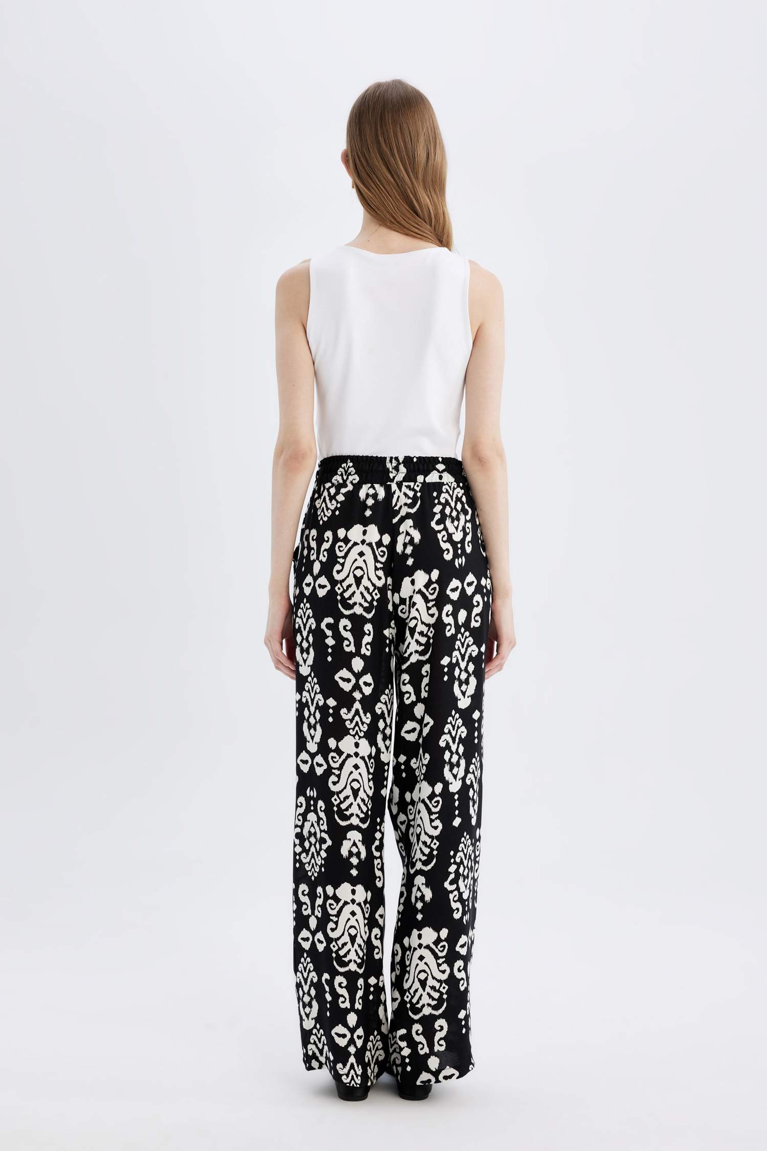 بنطرون فلورايدا وايد ليج برجل واسع بجيب وخصر عالي