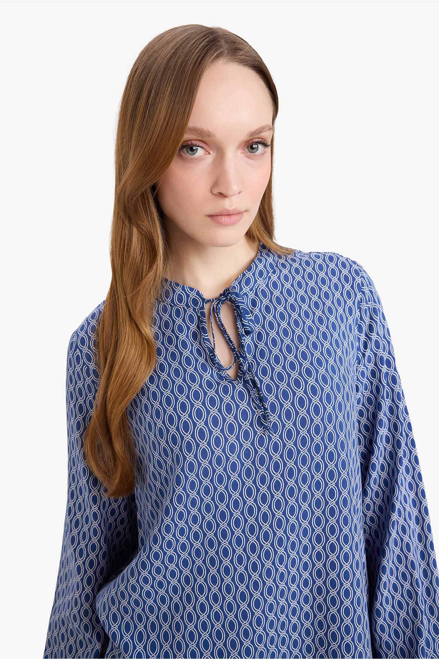 بلوزة كم طويل مطبوعة قصة عادية بياقة مستديرة