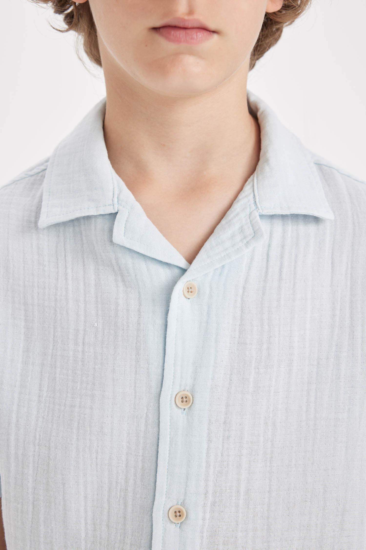 قميص بولو اولادي نص كم موسلين اوفر سايز