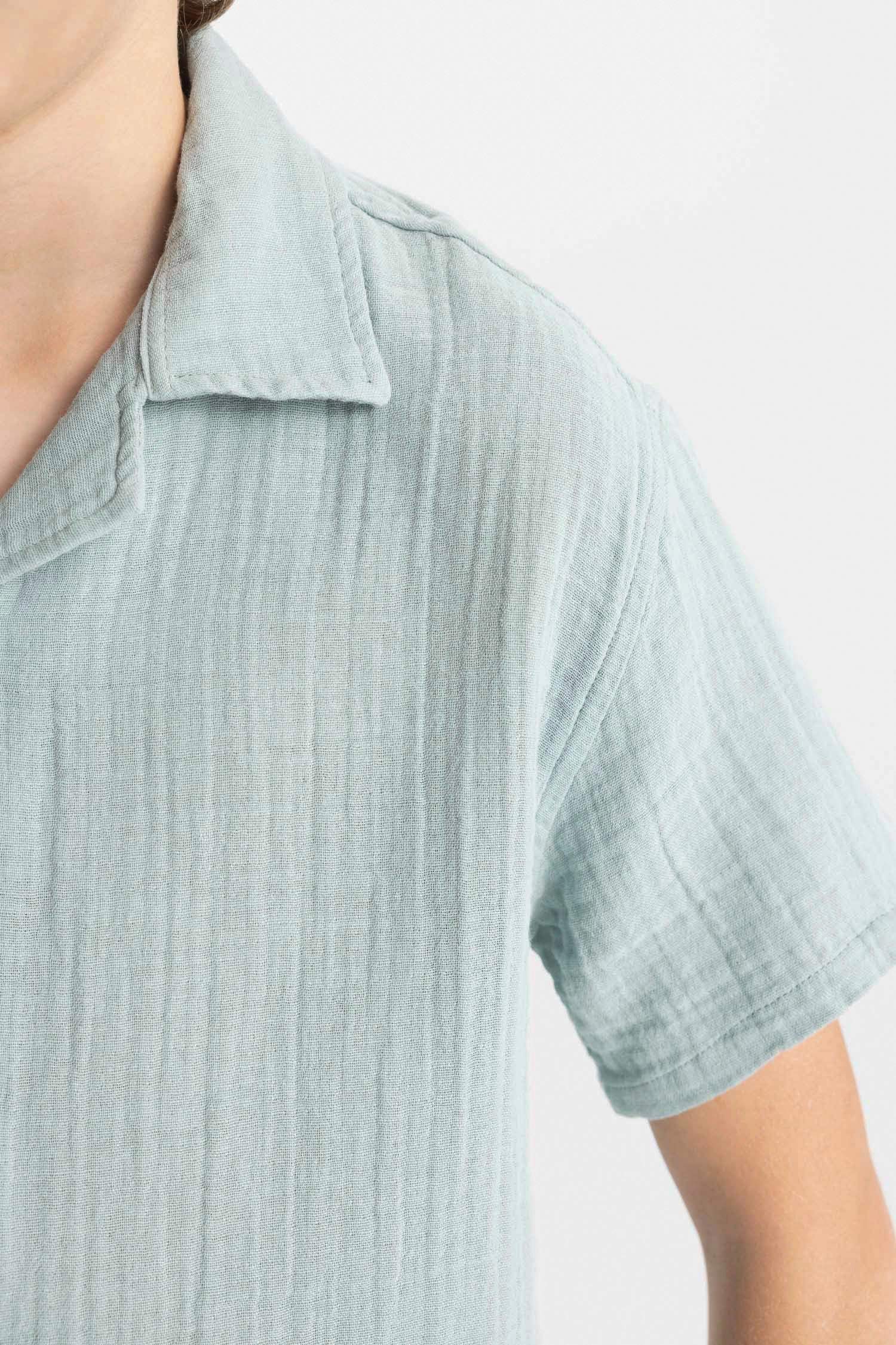 قميص بولو ولادي نص كم موسلين واسع