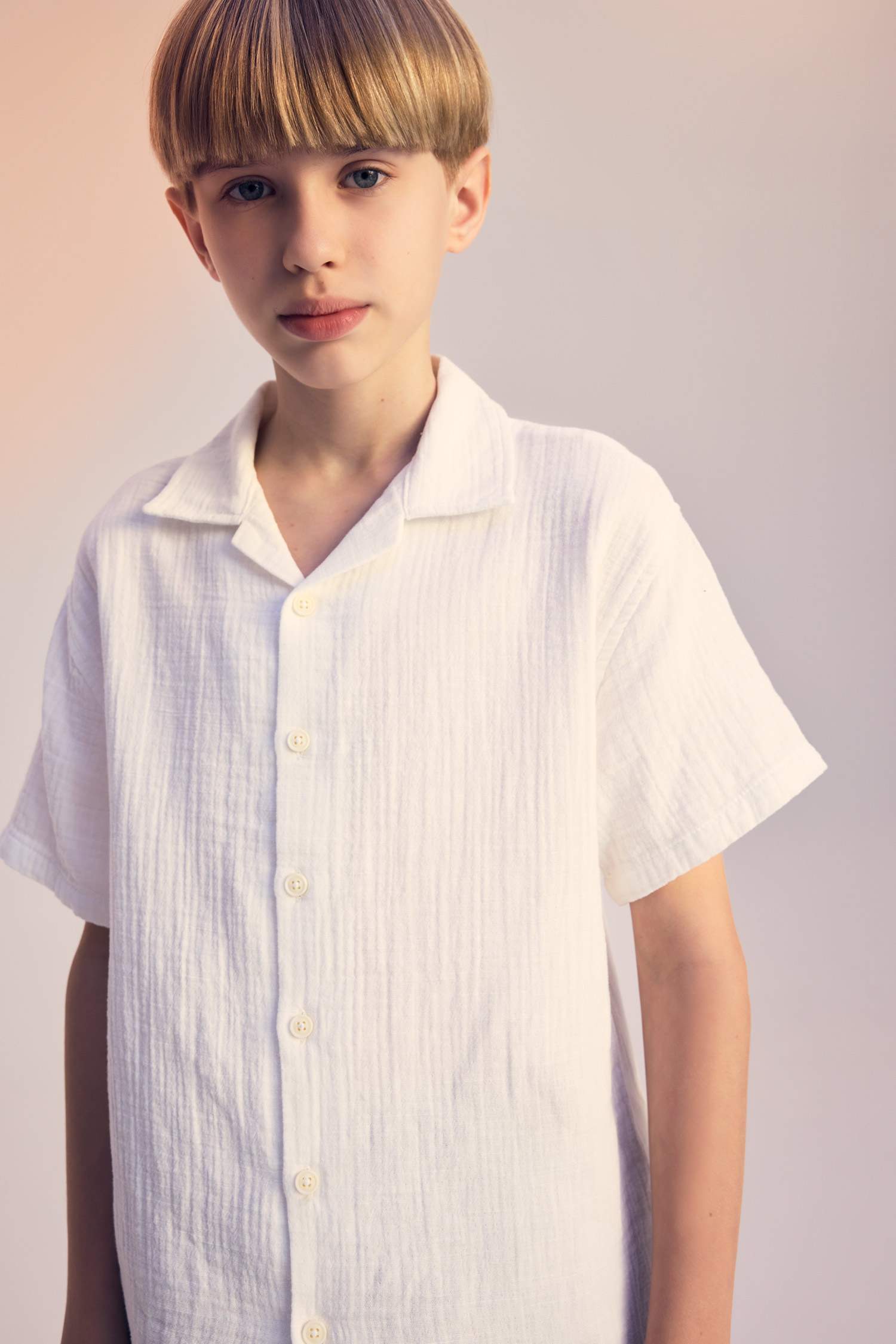 قميص بولو اولادي نص كم موسلين اوفر سايز