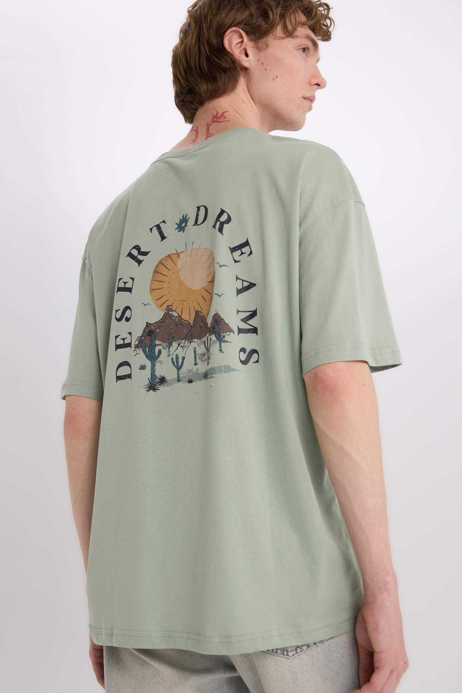 %100 Pamuk Oversize Geniş Kalıp Bisiklet Yaka Sırt Baskılı Kısa Kollu Tişört