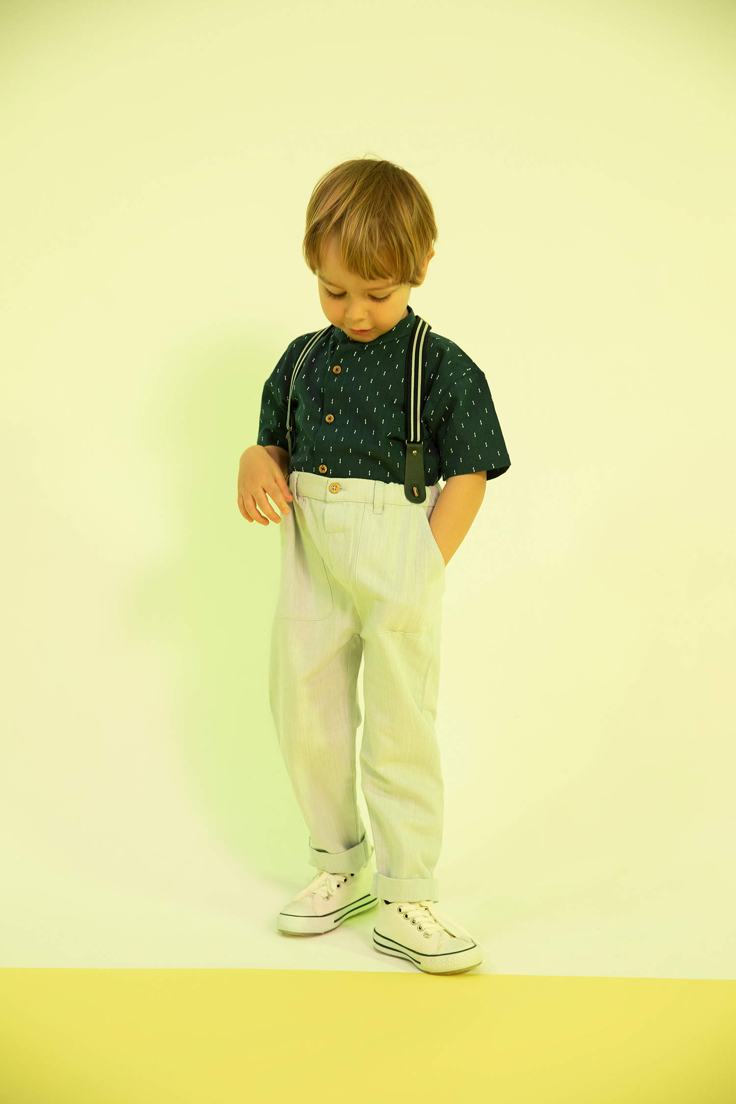 Portrait of a barefoot boy in a sleeveless shirt and trousers with  suspenders on a pile of straw Stock Photo  Alamy