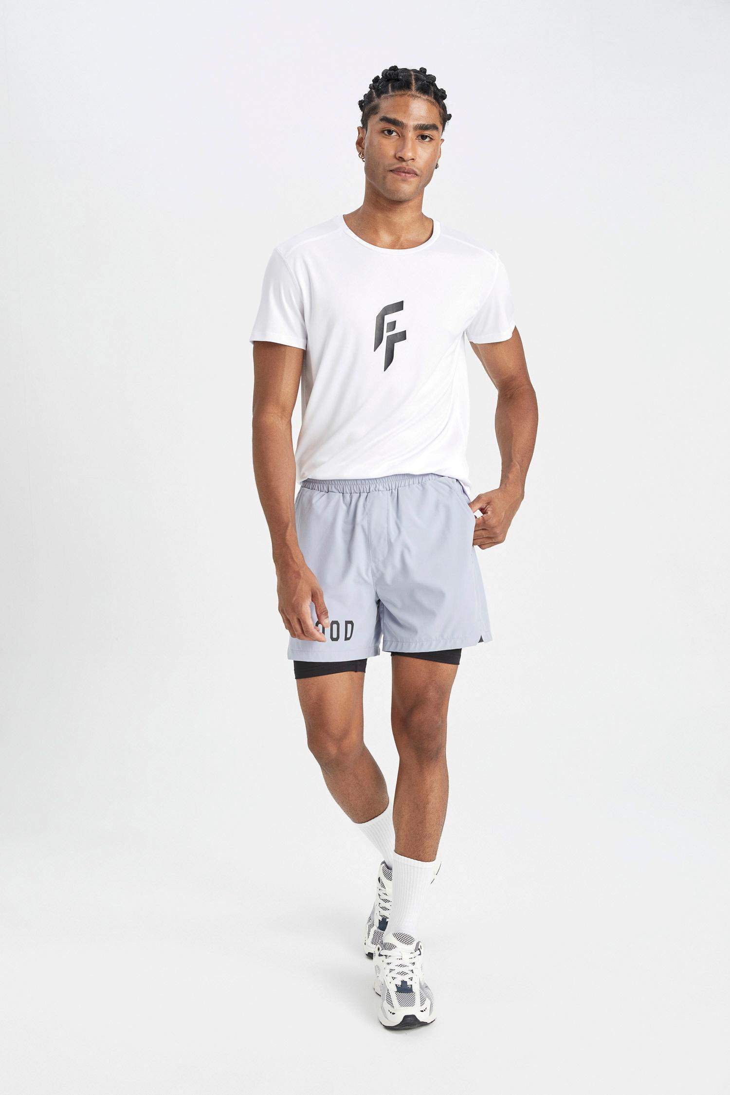 DeFactoFit Slim Fit Dar Kesim Fermuarlı Telefon Cepli Sporcu Taytlı Şort