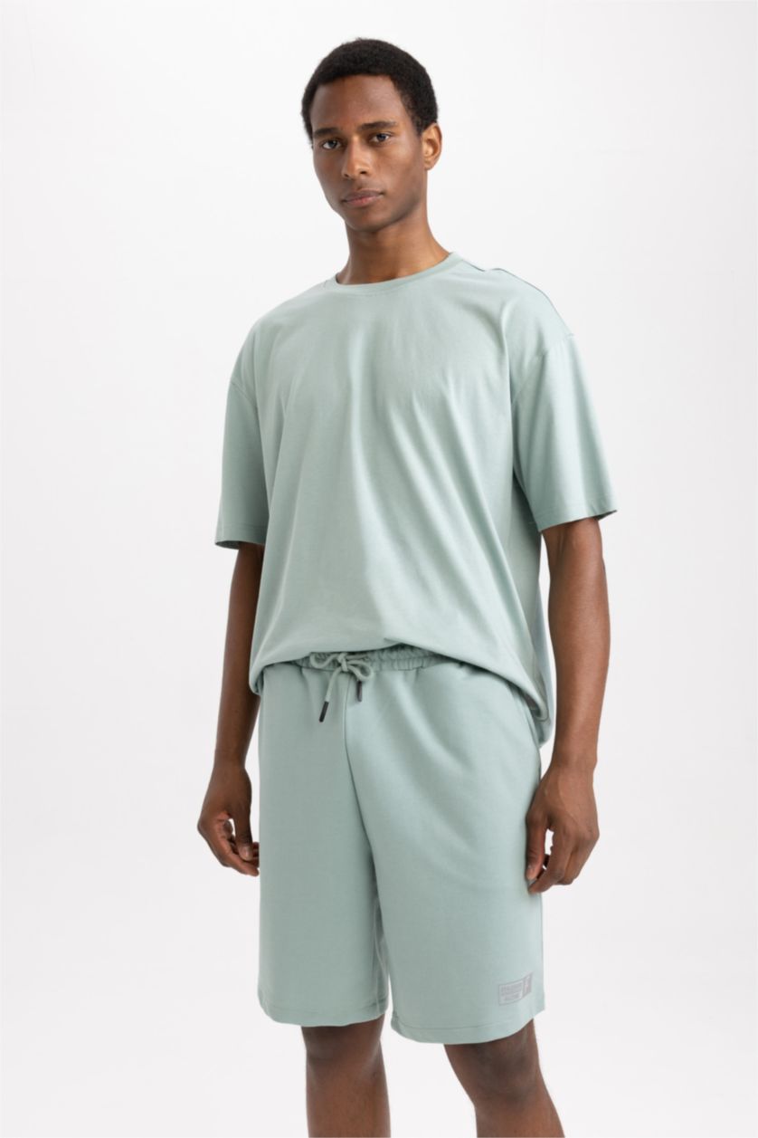 رجال أخضر فاتح تي شيرت نص ردن اوفر سايز مطبوع بياخة مستديرة من DeFactoFit