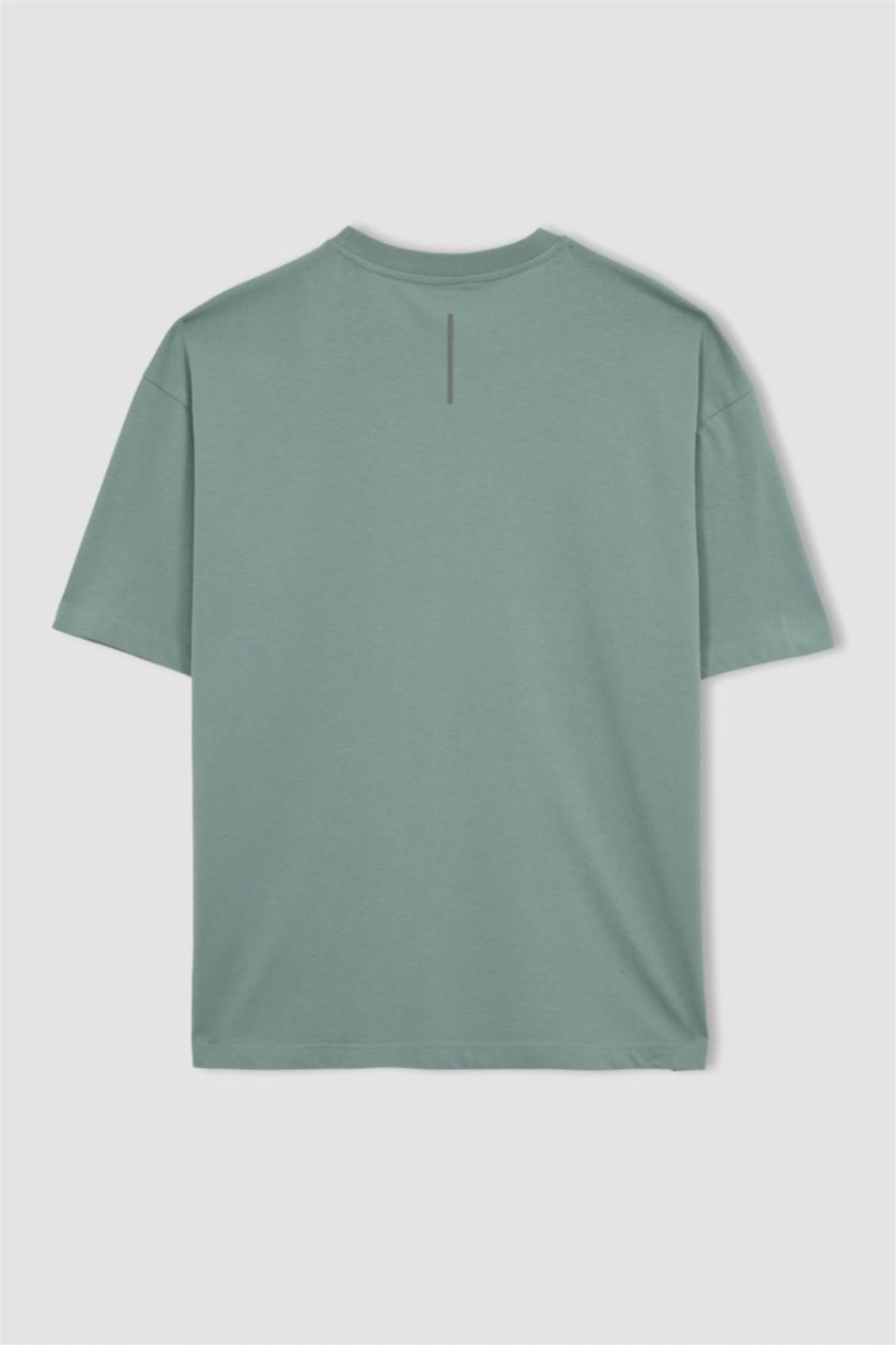 رجال أخضر فاتح تي شيرت نص ردن اوفر سايز مطبوع بياخة مستديرة من DeFactoFit