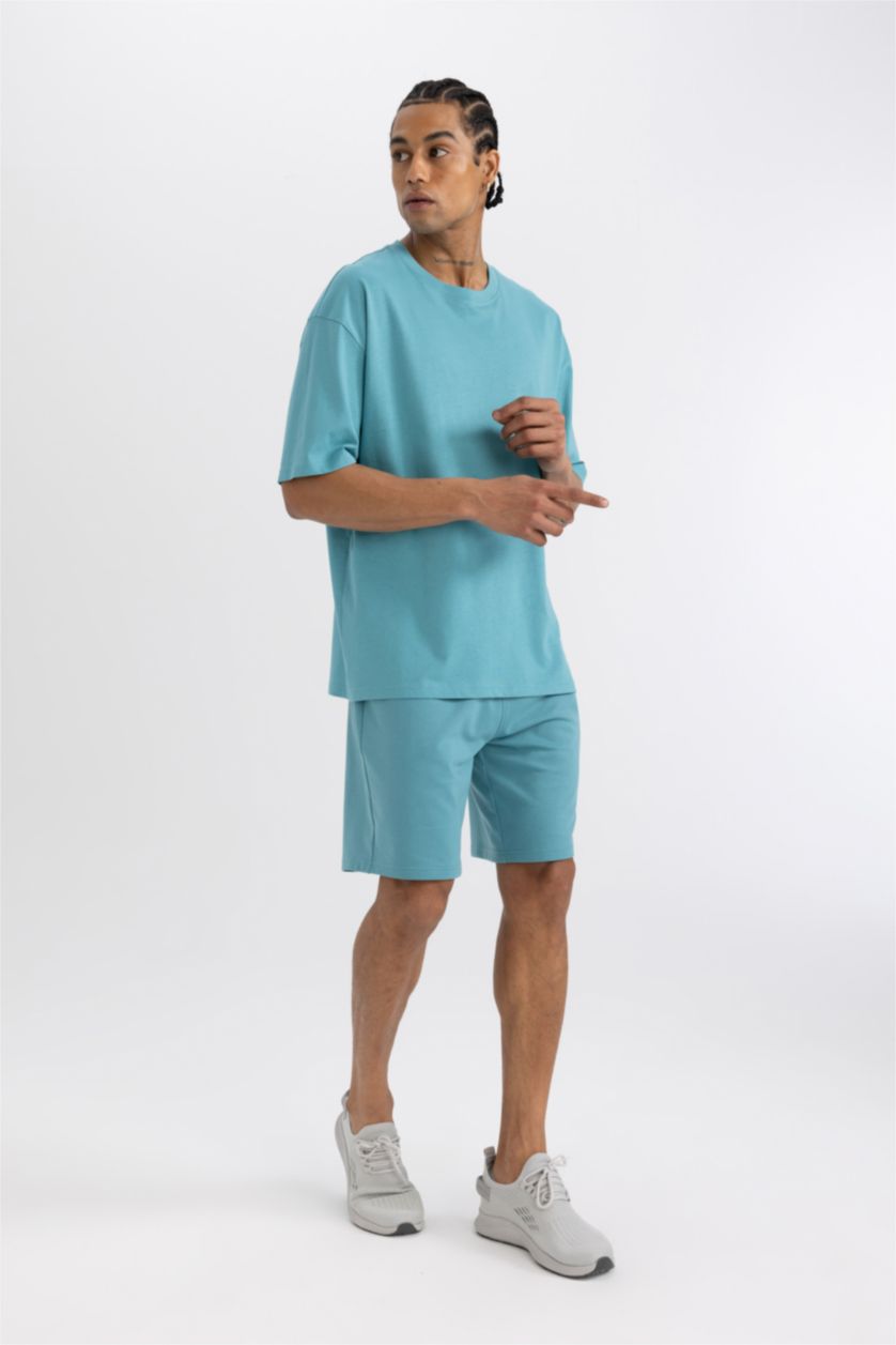 رجال فيروزي فاتح شورت قصير سليم فيت بجيب مزدوج من DeFactoFit