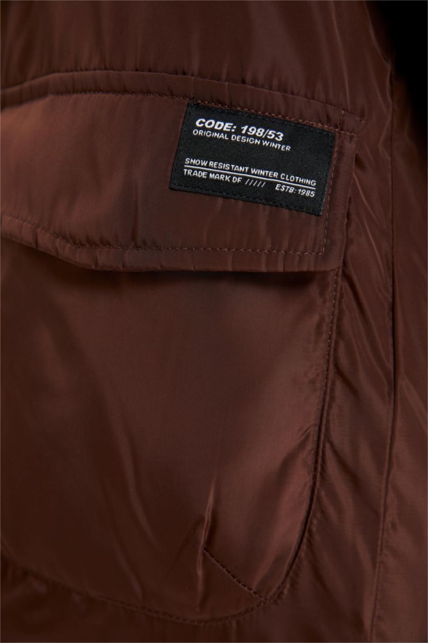 أولادي بني جاكيت بامب اولادي طارد للماء بكابيشون