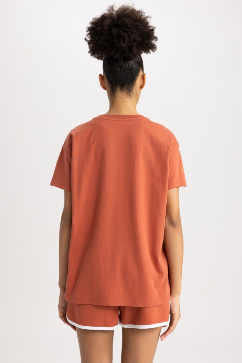 نساء اللون الطوبي تيشيرت واسع قطن بطباعة الشعار ورقبة مستديرة