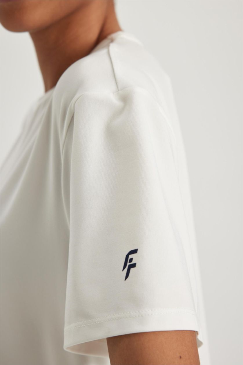 حريمي بيج فاتح تي شيرت رياضي قصة مريحة برقبة مستديرة