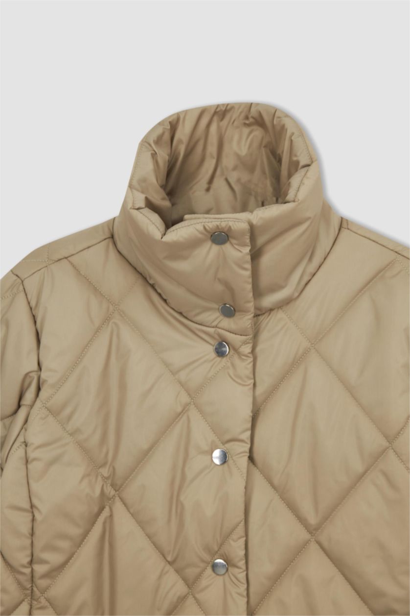 نساء اللون الرملي جاكيت بقصة عادية بياقة واقفة وتر بروف