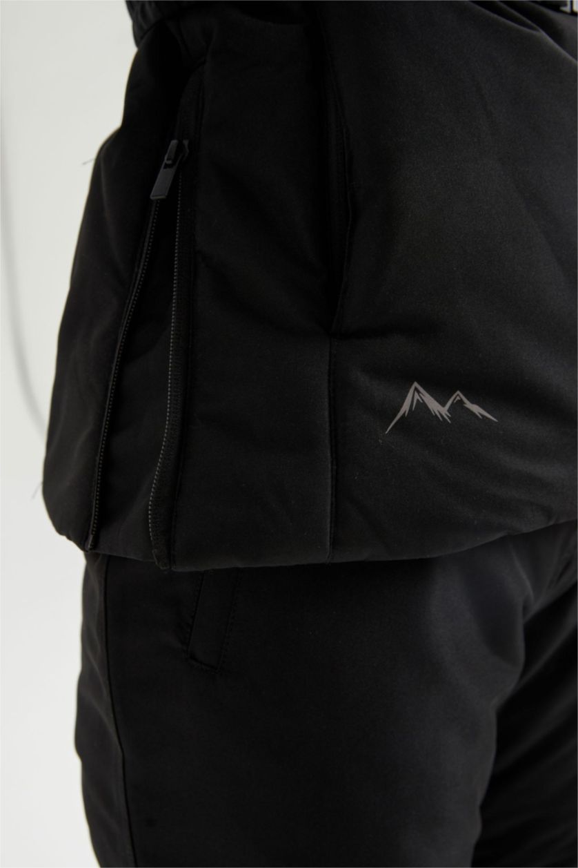 حريمي أسود جاكيت ثلج سليم فيت بكابيشون ببطانة صوفية من DeFactoFit