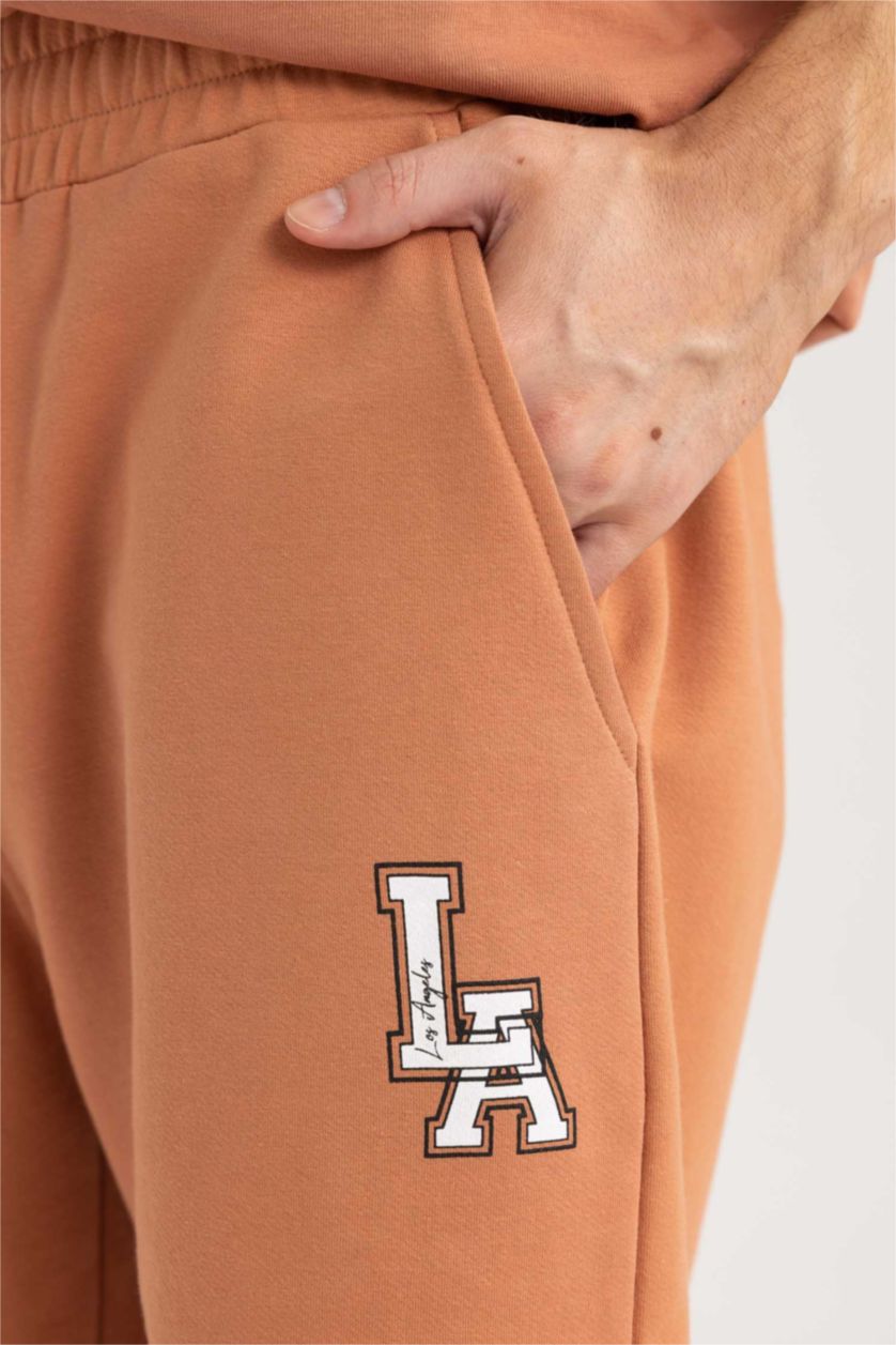 رجال برتقالي شورت سليم فيت بجيب