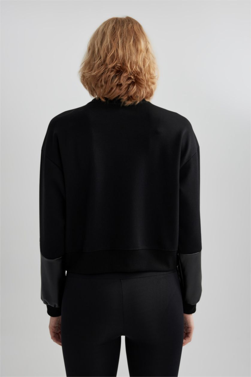 نساء أسود سويت شيرت واسع برقبة مستديرة