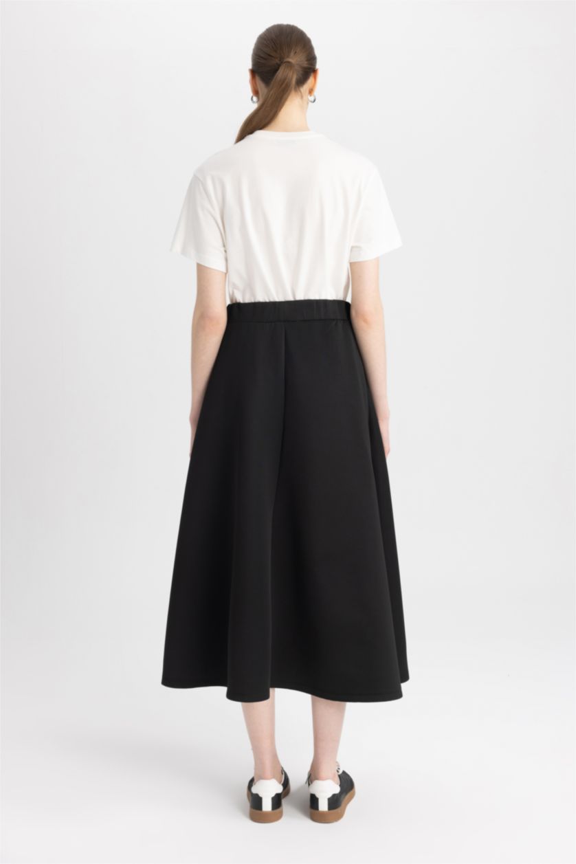 حريمي أسود جيبة من قماش سكوبا قصة A