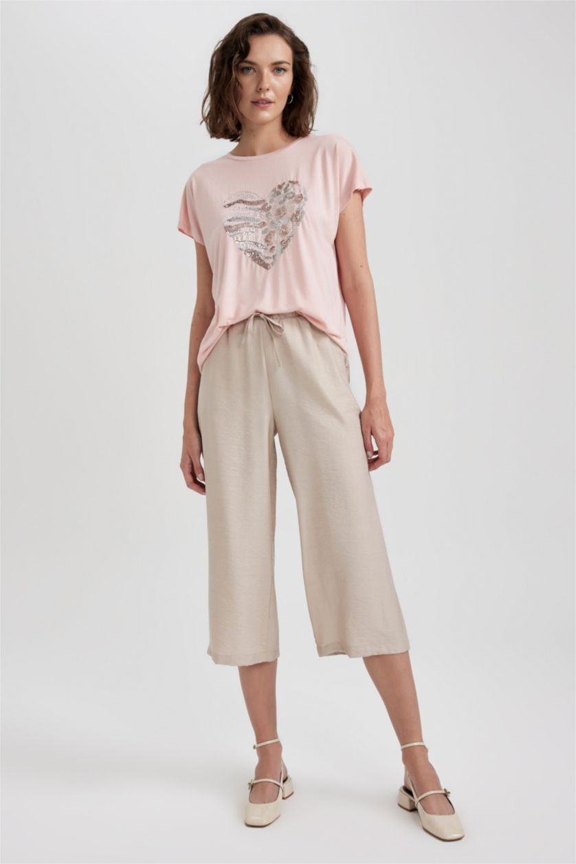 حريمي بيج بنطلون كابري كتان بجيب