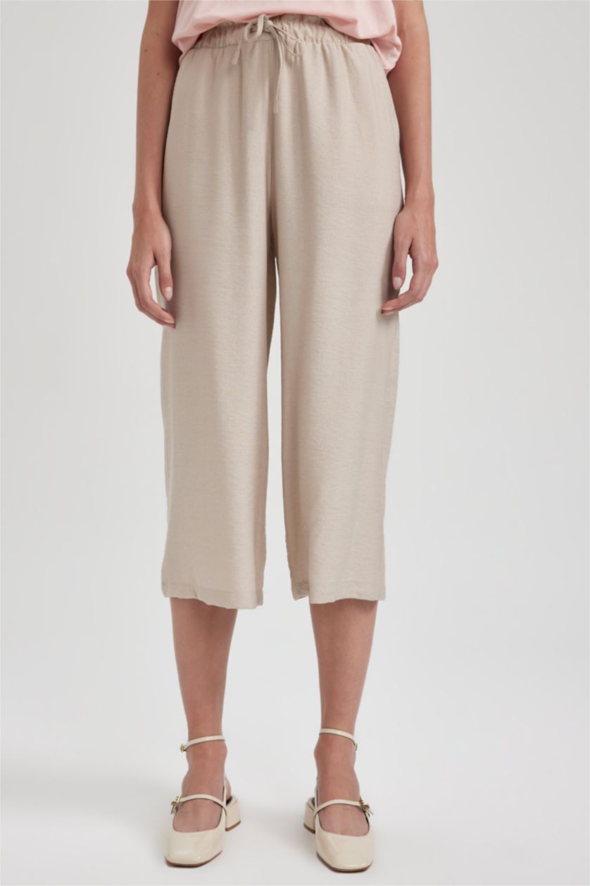 حريمي بيج بنطلون كابري كتان بجيب