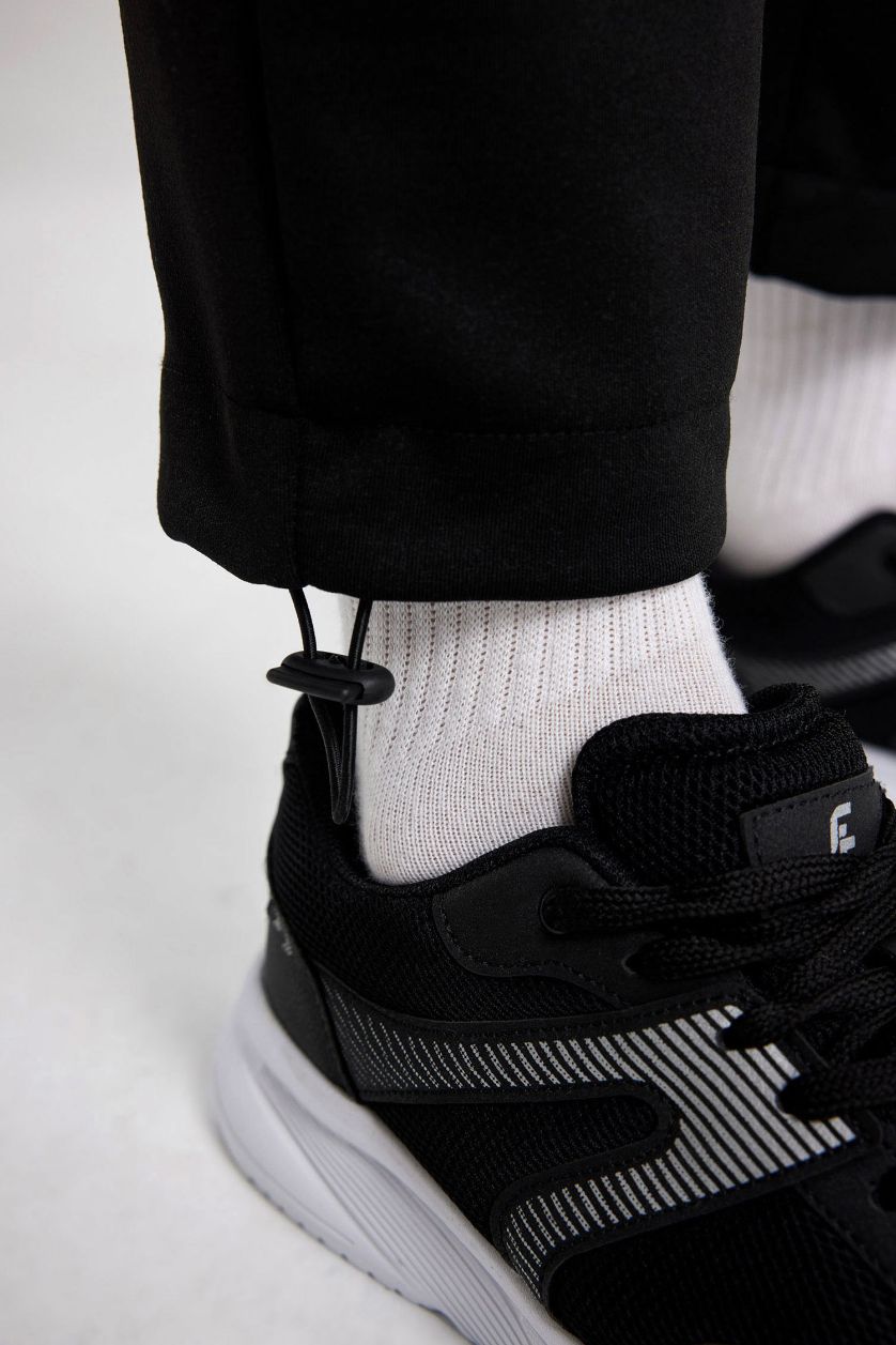 نساء أسود بنطلون بجامة رياضي قماش سكوبا قصة عادية بجيب من DeFactoFit