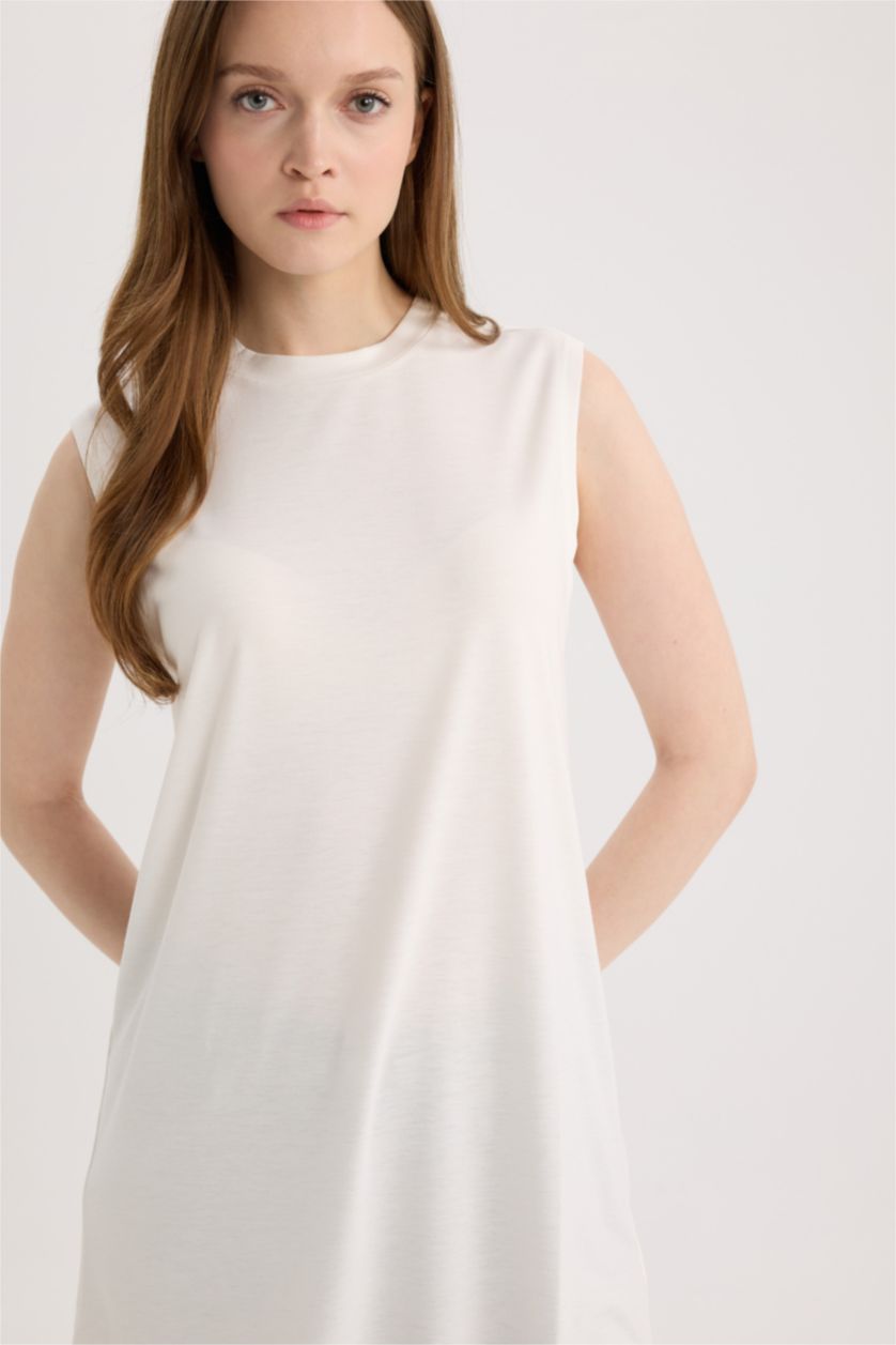 نساء بيج فاتح بلوزة كت بدون ردن قصة عادية بياخة مستديرة