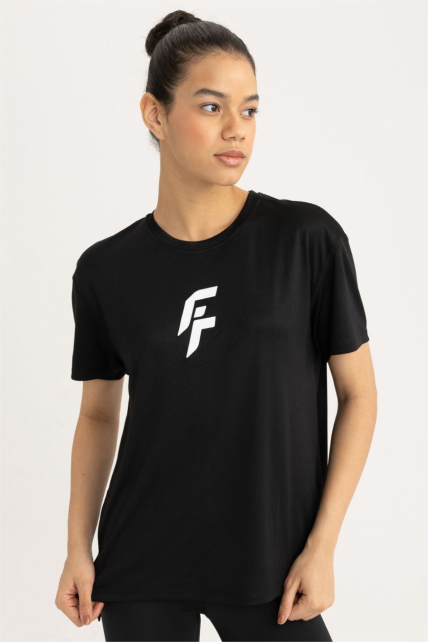 FEMME Noir T-Shirt de sport à manches courtes et col rond Coupe Standard