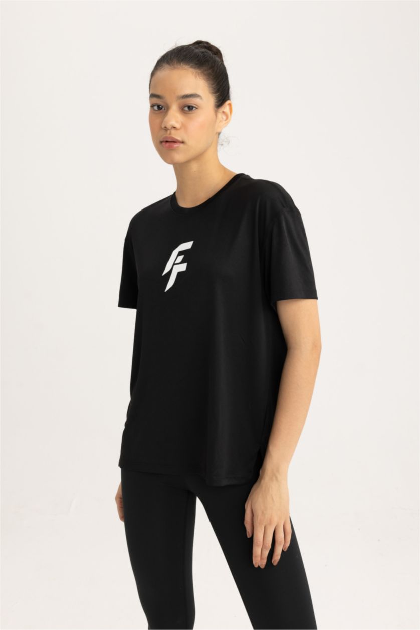 FEMME Noir T-Shirt de sport à manches courtes et col rond Coupe Standard