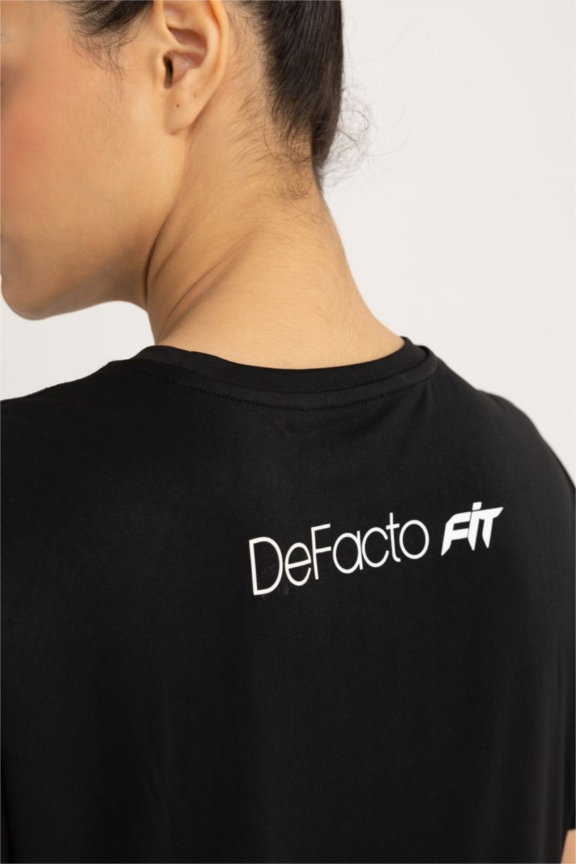 FEMME Noir T-Shirt de sport à manches courtes et col rond Coupe Standard