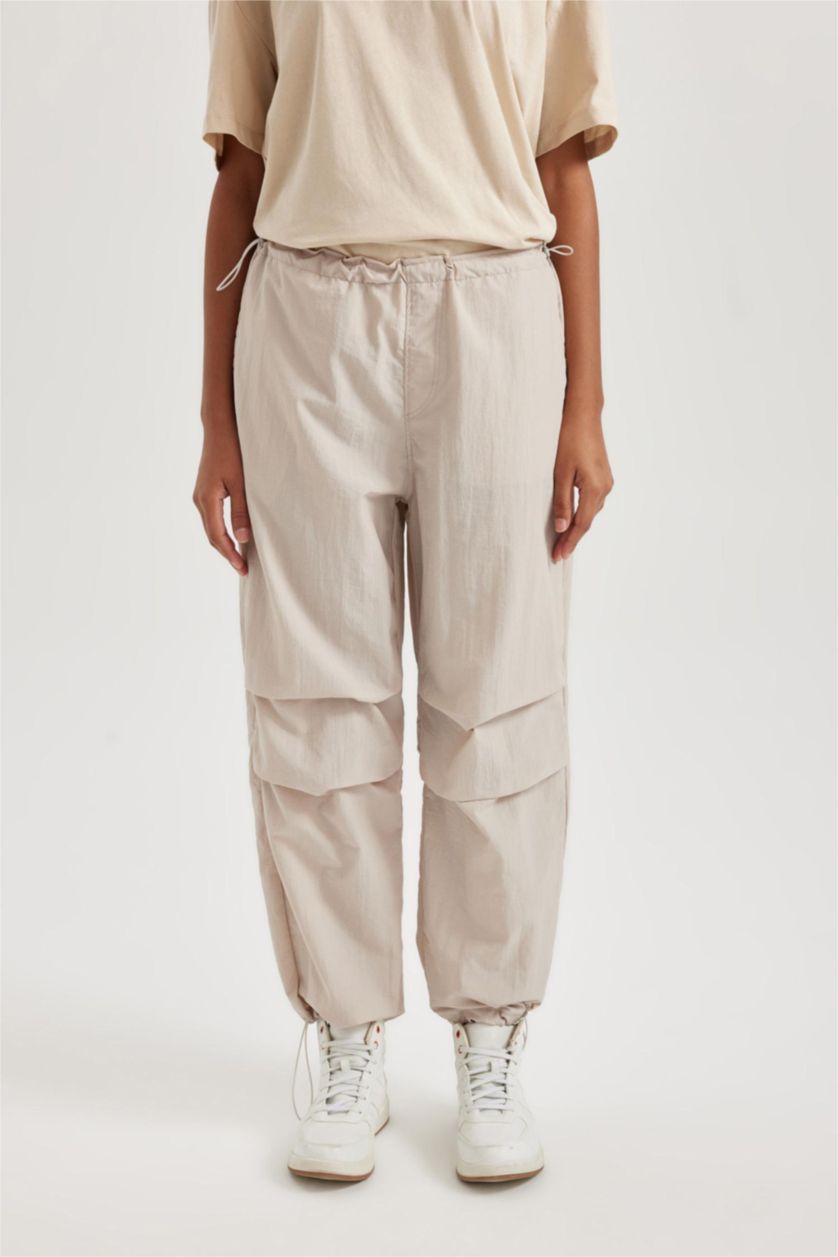 حريمي اللون الحجري بنطلون جوجر قصة عادية بأستك من تحت بجيب من DeFactoFit