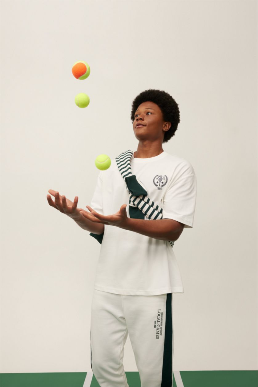 رجالي بيج فاتح تيشيرت اوفر سايز بطبعة شعار من DeFactoFit