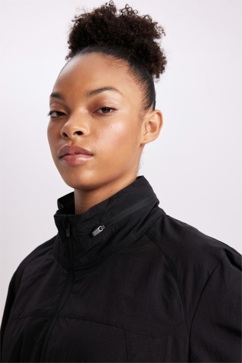 نساء أسود جاكيت مطر سليم فيت بغطاء للرأس طارد للماء من DeFactoFit