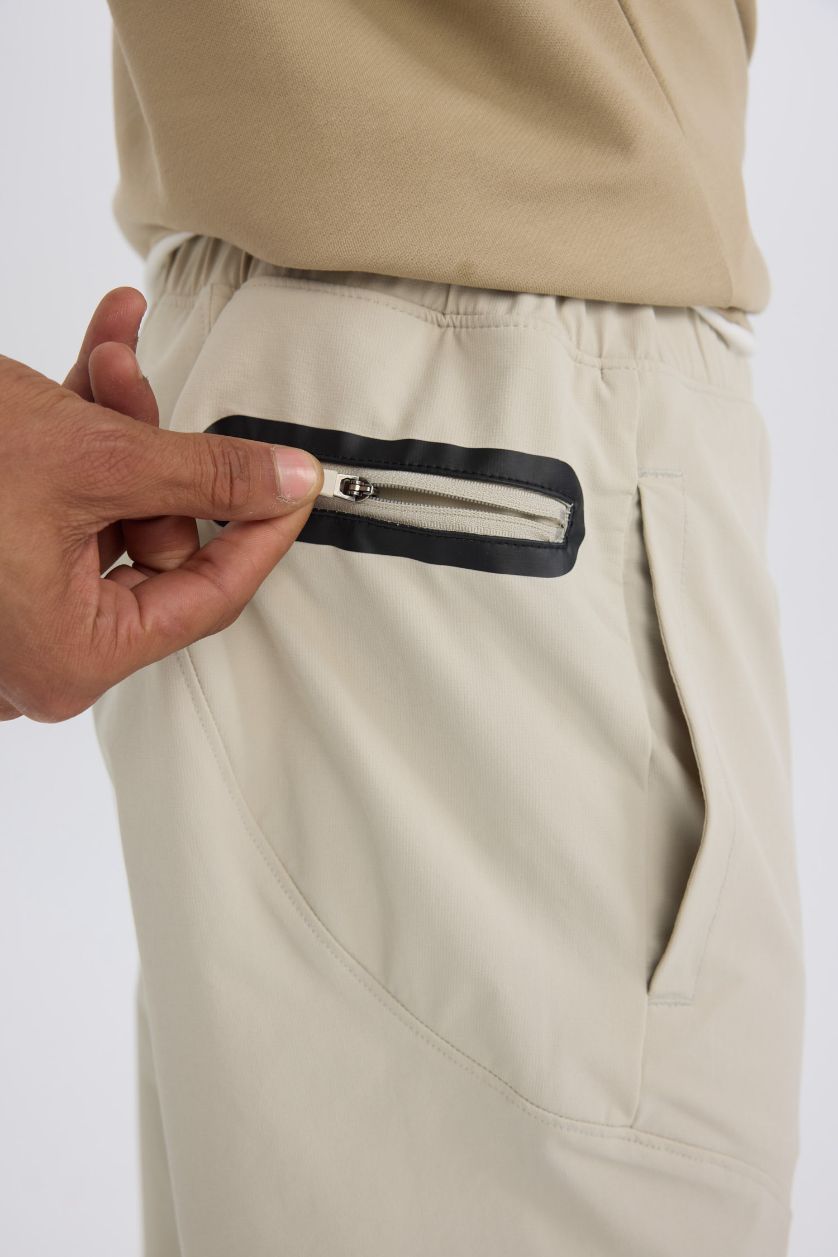 Erkek Açık Bej Esnek Kumaş Sporcu Jogger Eşofman Altı Slim Fit Dar Kesim Dokuma Üç Cepli Fermuarlı Paça