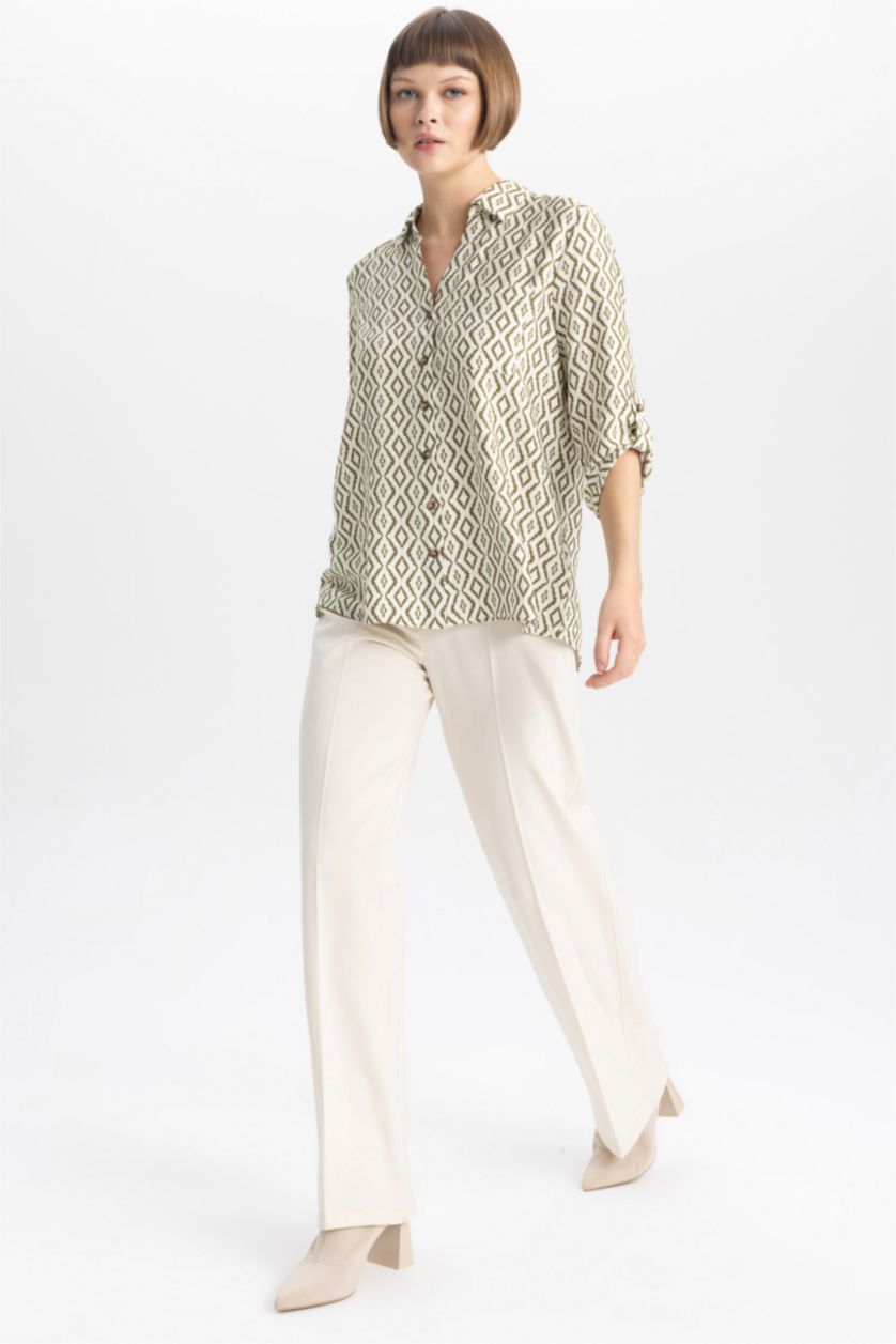 حريمي بيج فاتح قميص كم طويل قصة عادية بياقة V