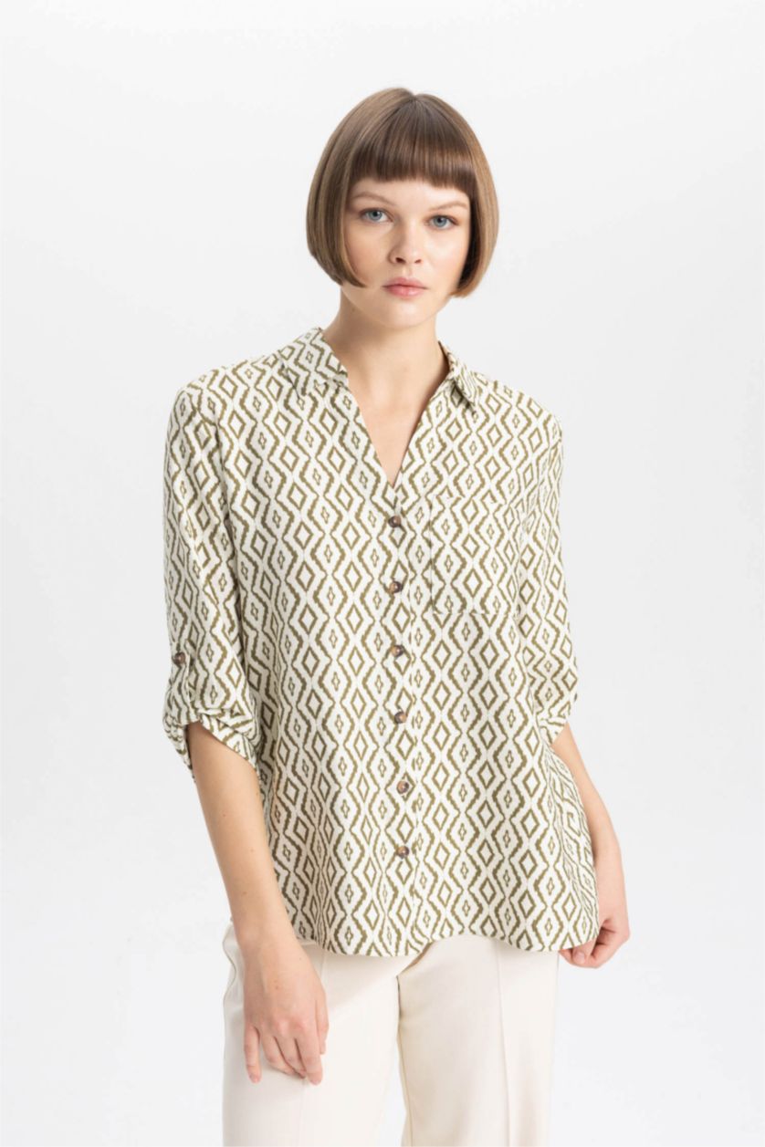 حريمي بيج فاتح قميص كم طويل قصة عادية بياقة V