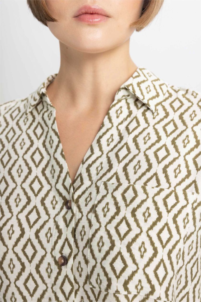 حريمي بيج فاتح قميص كم طويل قصة عادية بياقة V