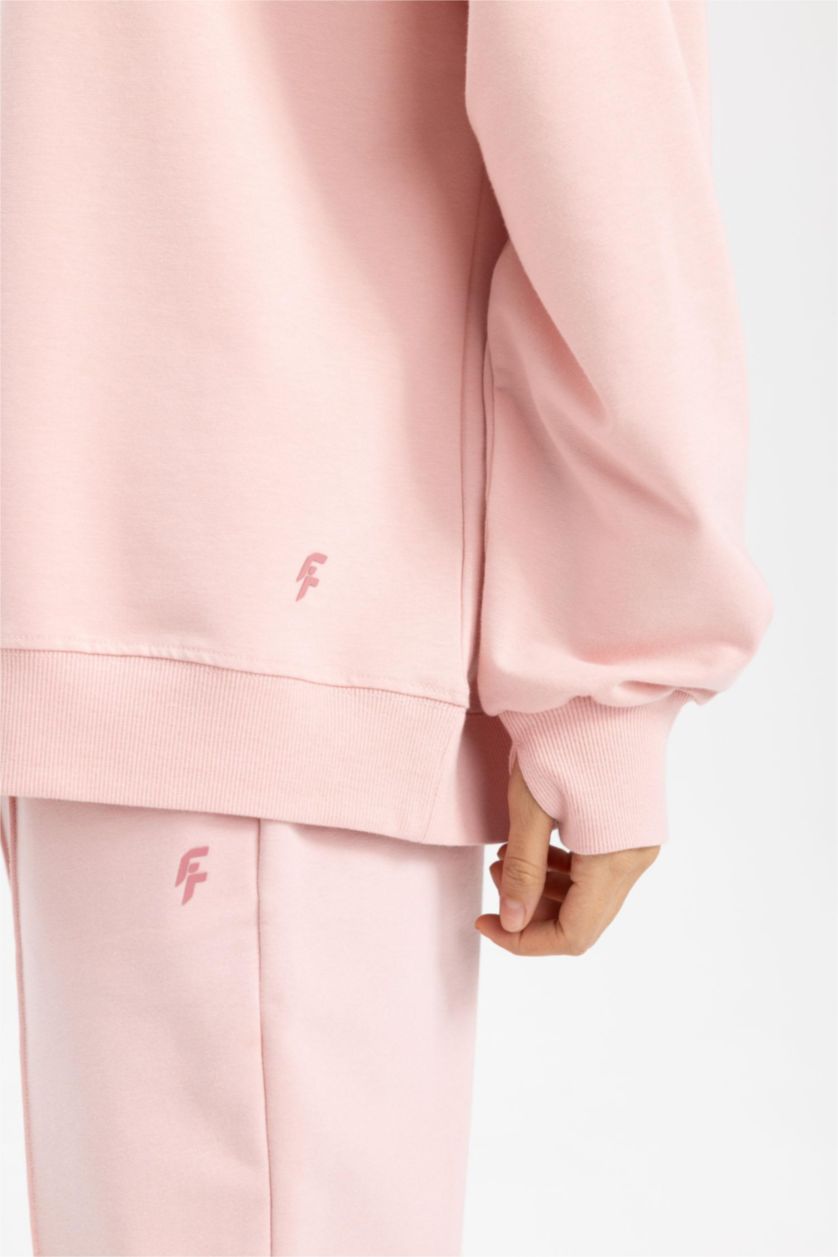 حريمي وردي سويت شيرت رياضي اوفر سايز بكابيشون بجيب من DeFactoFit