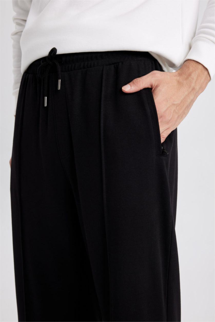 MAN Black Relax Fit Wide Leg Trousers